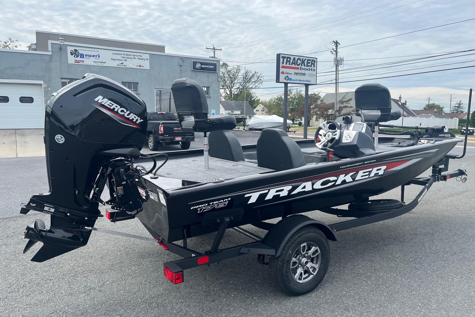 2026 Tracker Pro Team 175 boat with Mercury engine on display outdoors.