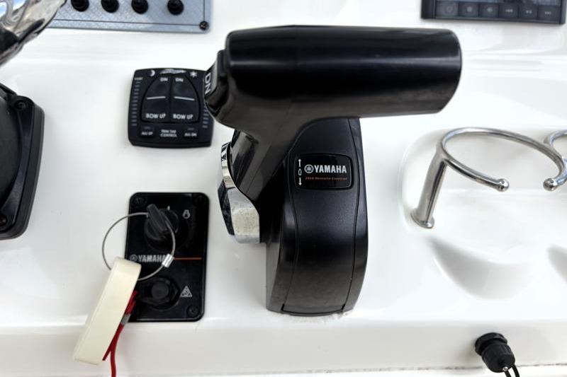 Control panel of 2024 Key West 239 FS boat featuring Yamaha throttle and switches.