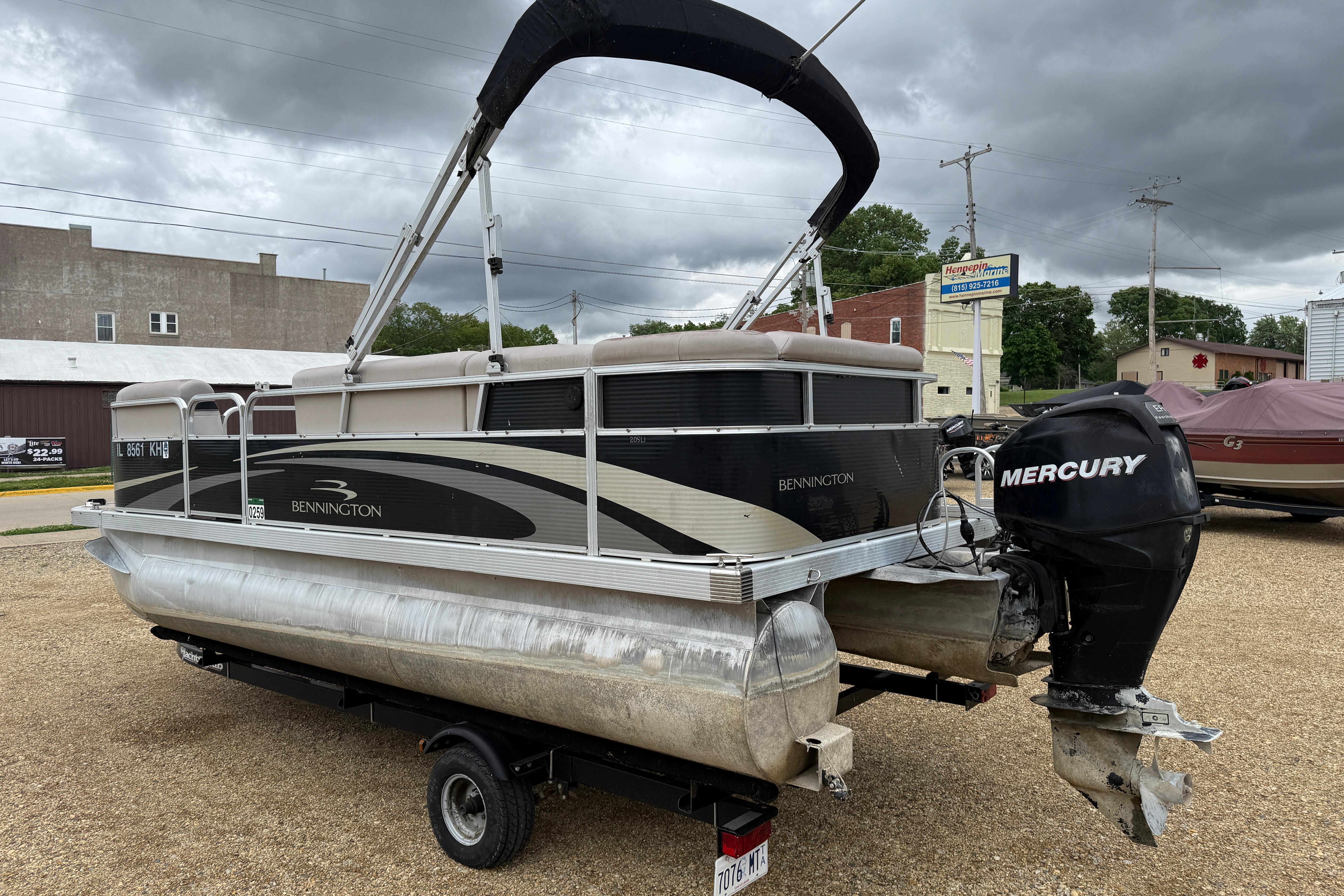 2010 Bennington 20SLi pontoon boat with Mercury outboard motor on a trailer.