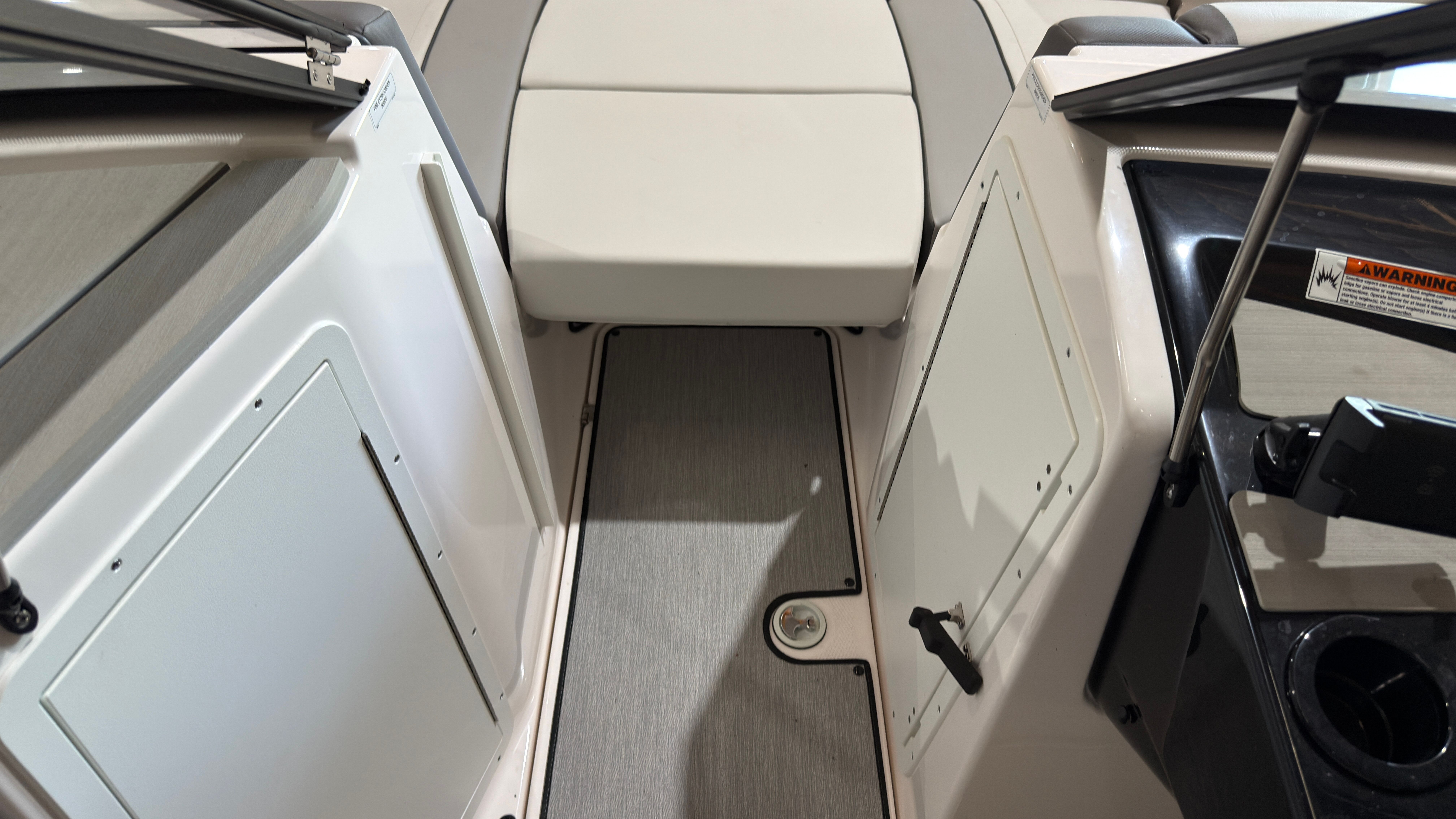 Interior of 2024 Yamaha Boats AR220 with seating and storage area.