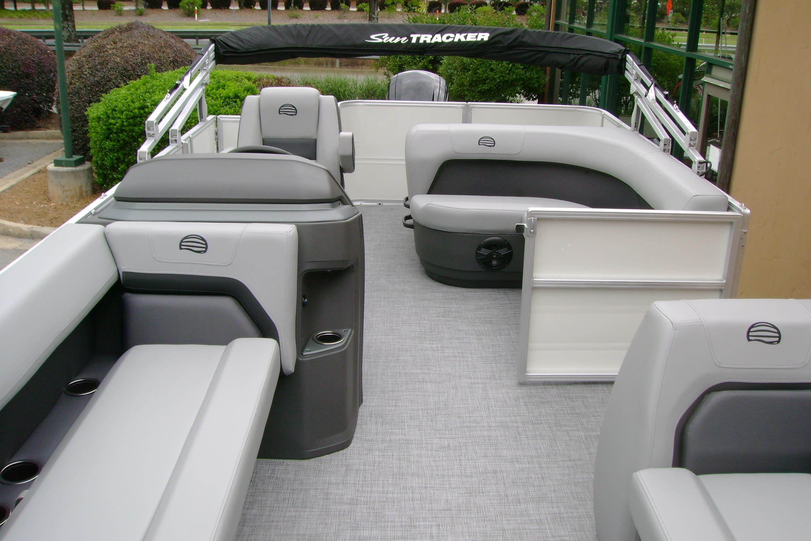 2026 Sun Tracker Party Barge 18 DLX interior with gray seating and spacious layout.