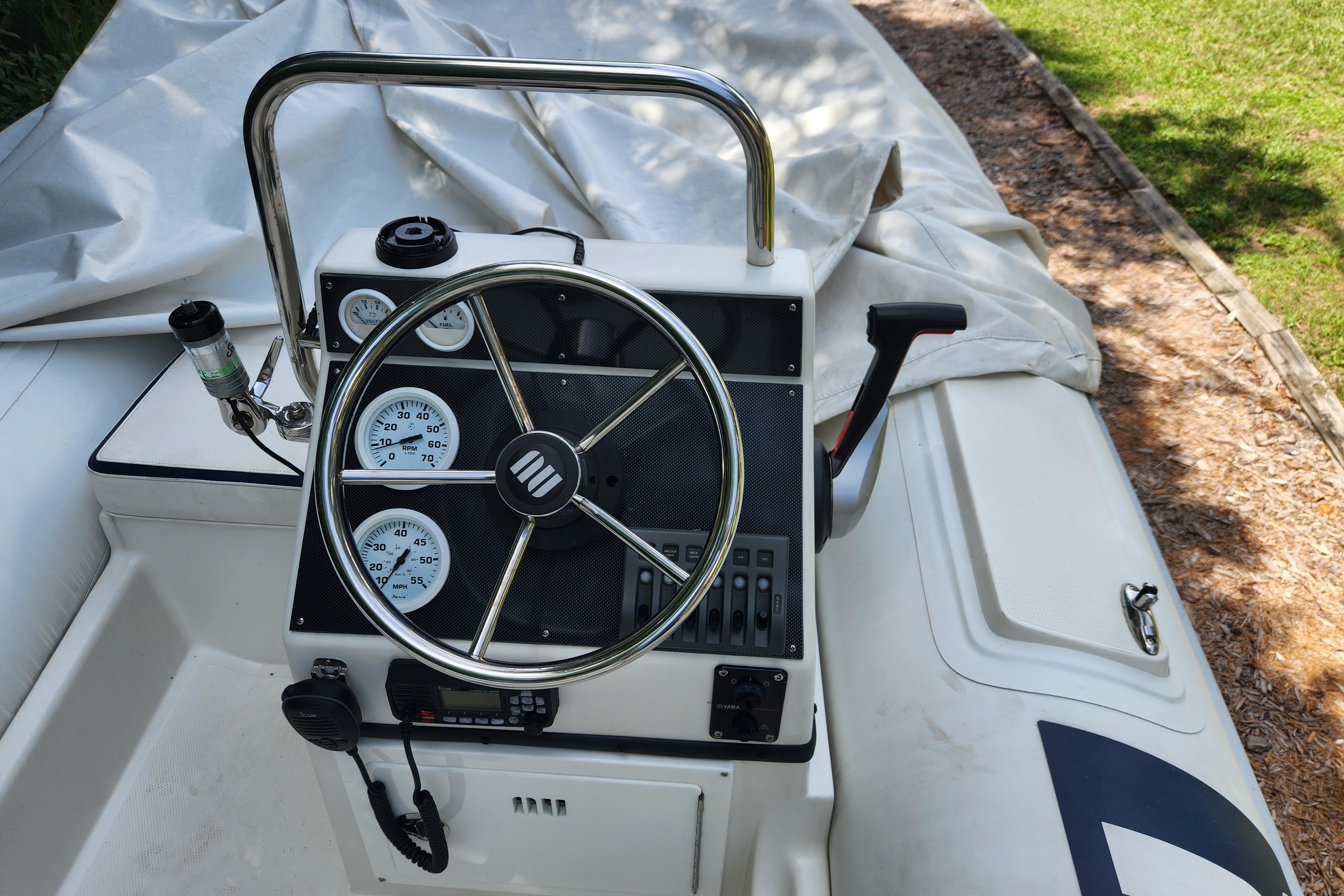 2019 Novurania DL 400 boat console with steering wheel and gauges.