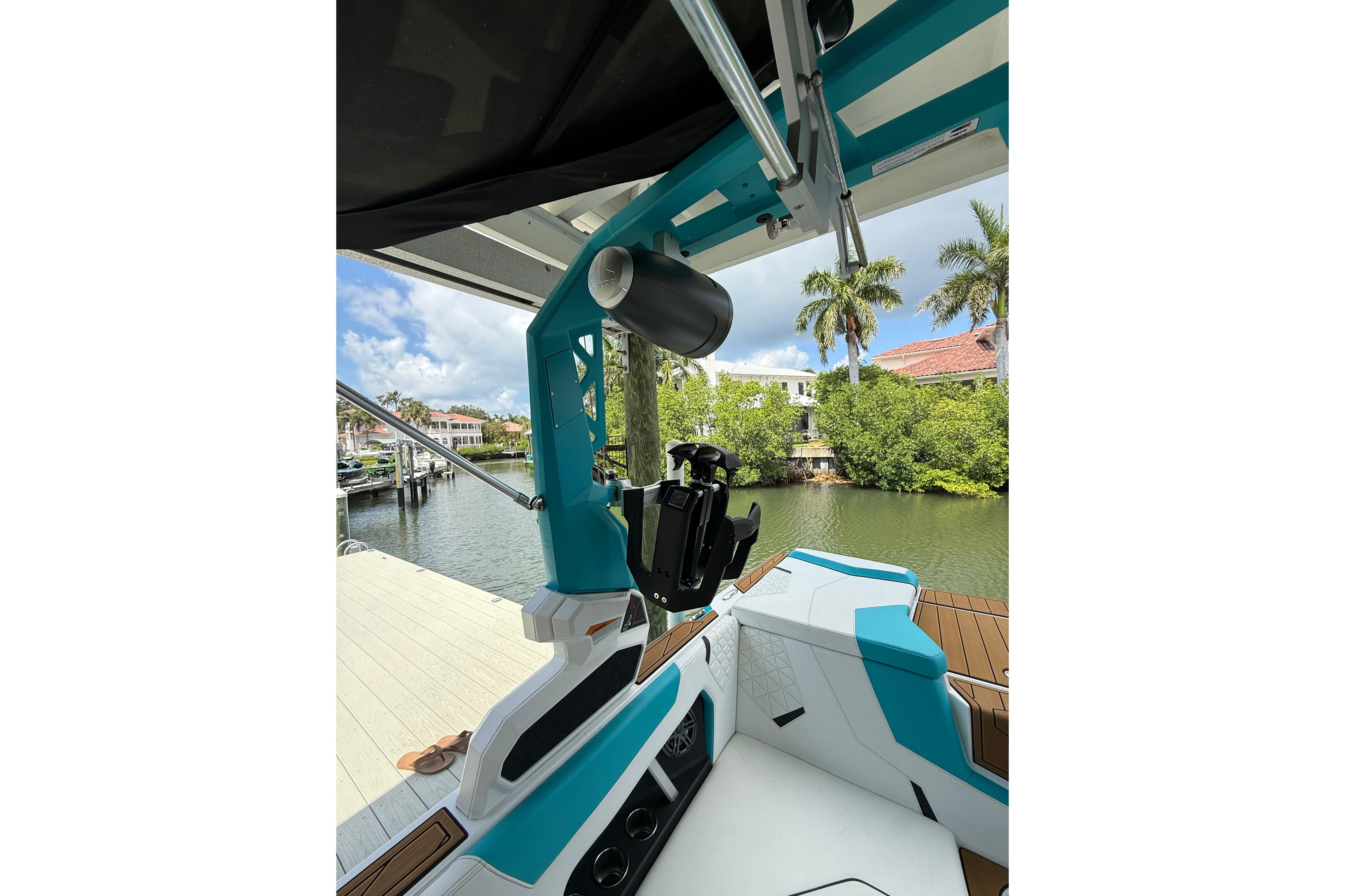 2024 Nautique Super Air Nautique GS20 boat interior with teal accents and speaker system.