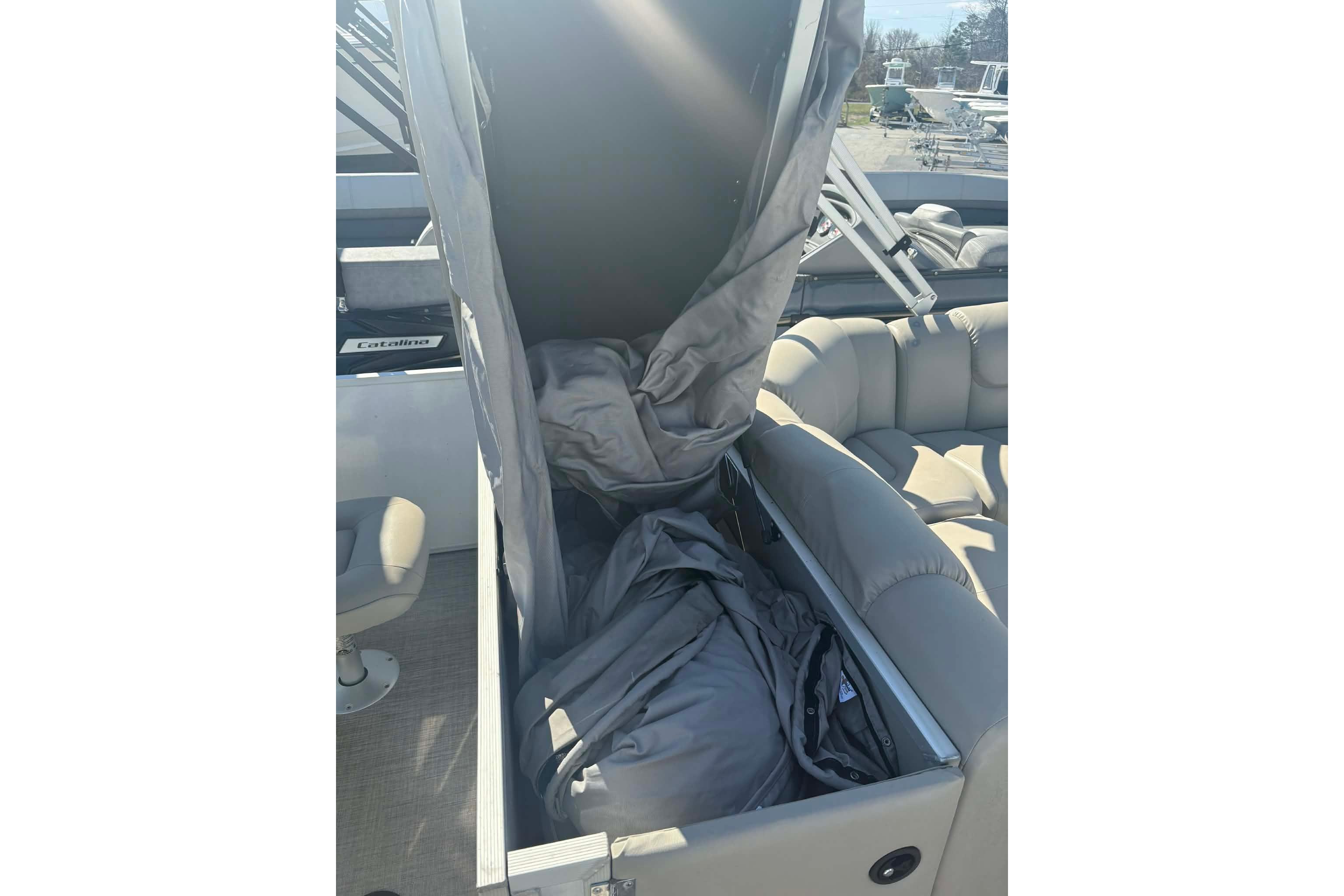 2017 G3 boat interior with open storage compartment and gray seating.