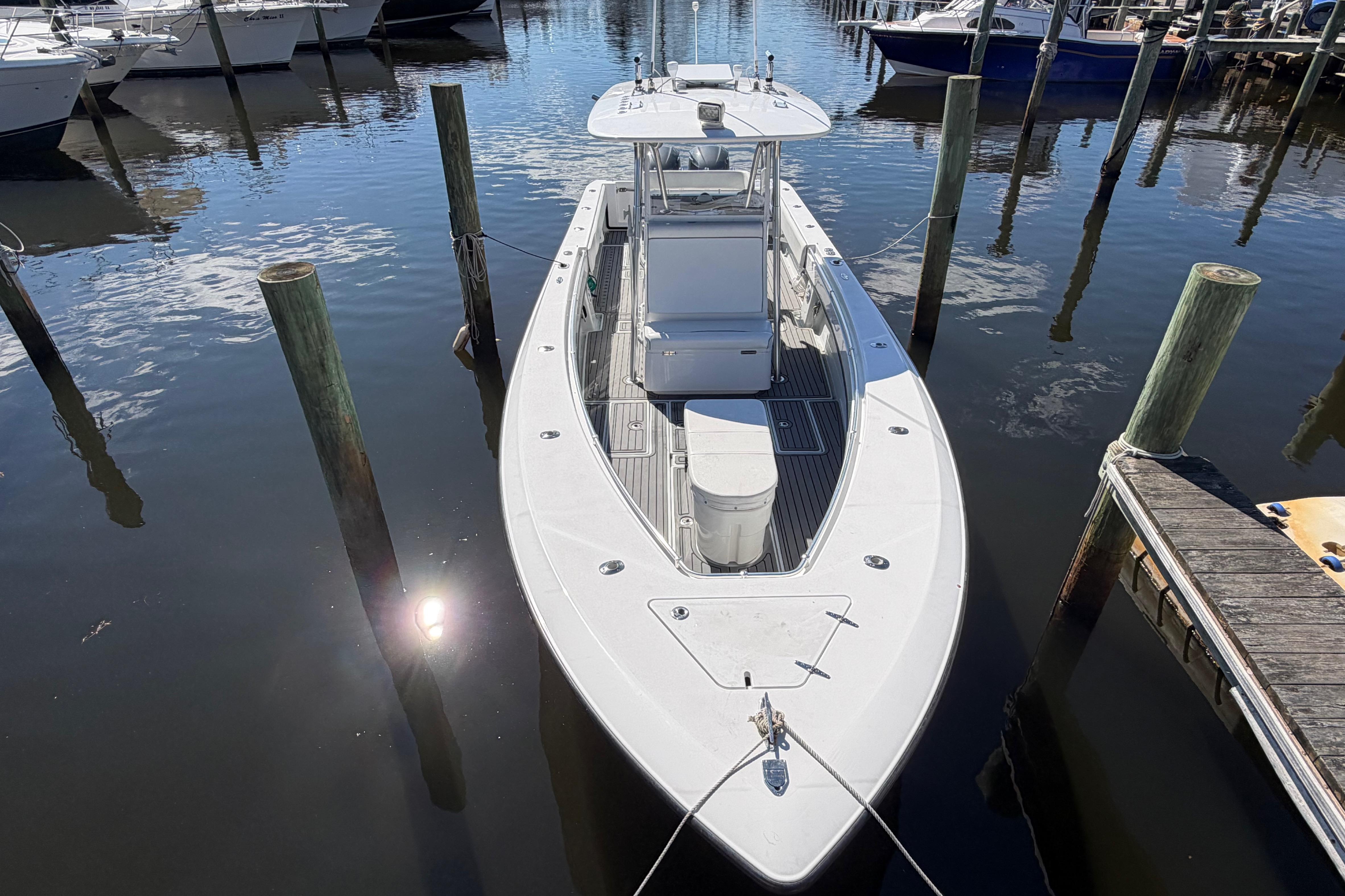 2015 Contender 32 ST boat docked in a marina, viewed from above.