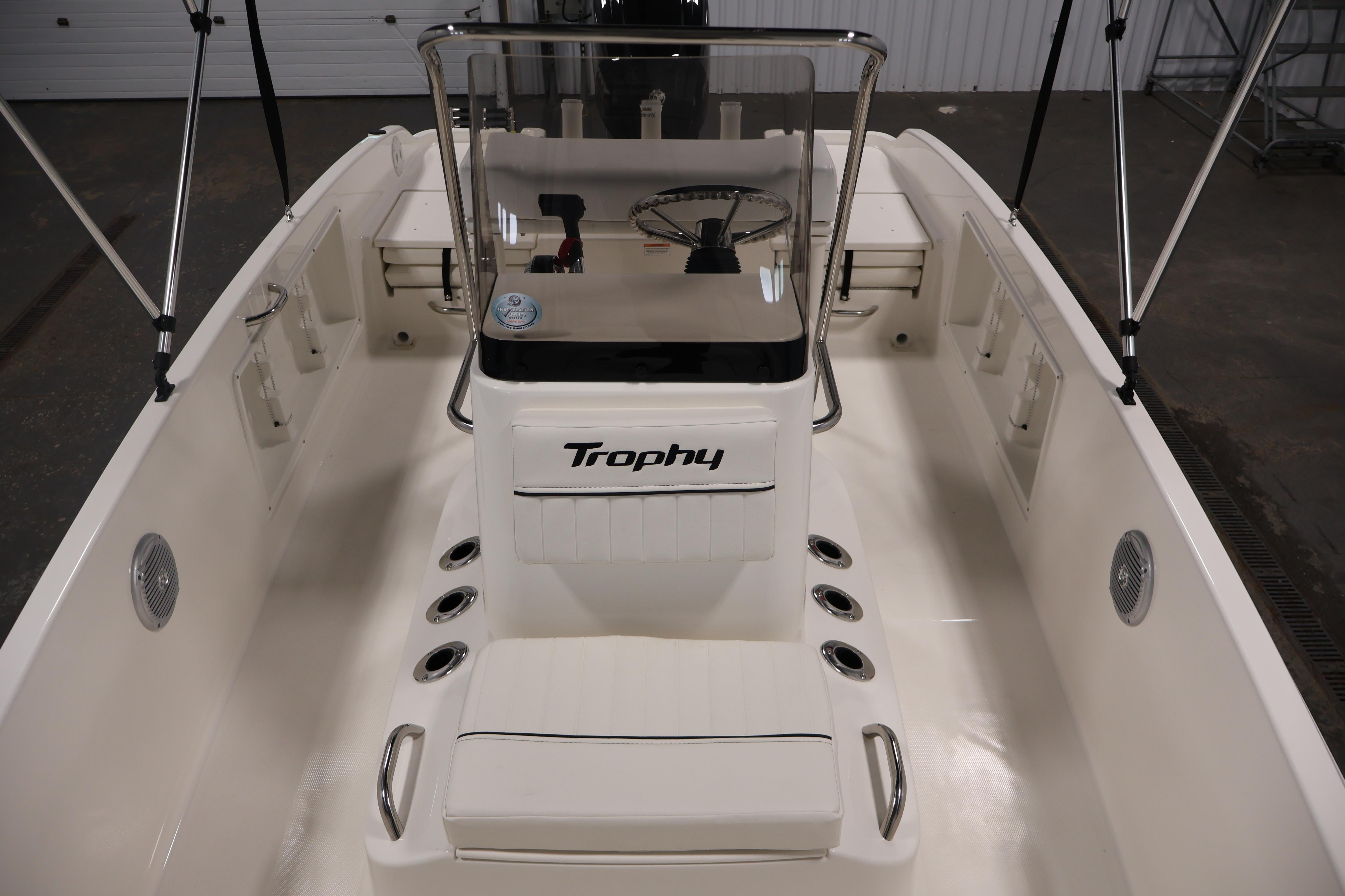 2026 Bayliner Trophy T18 boat interior with steering console and seating.