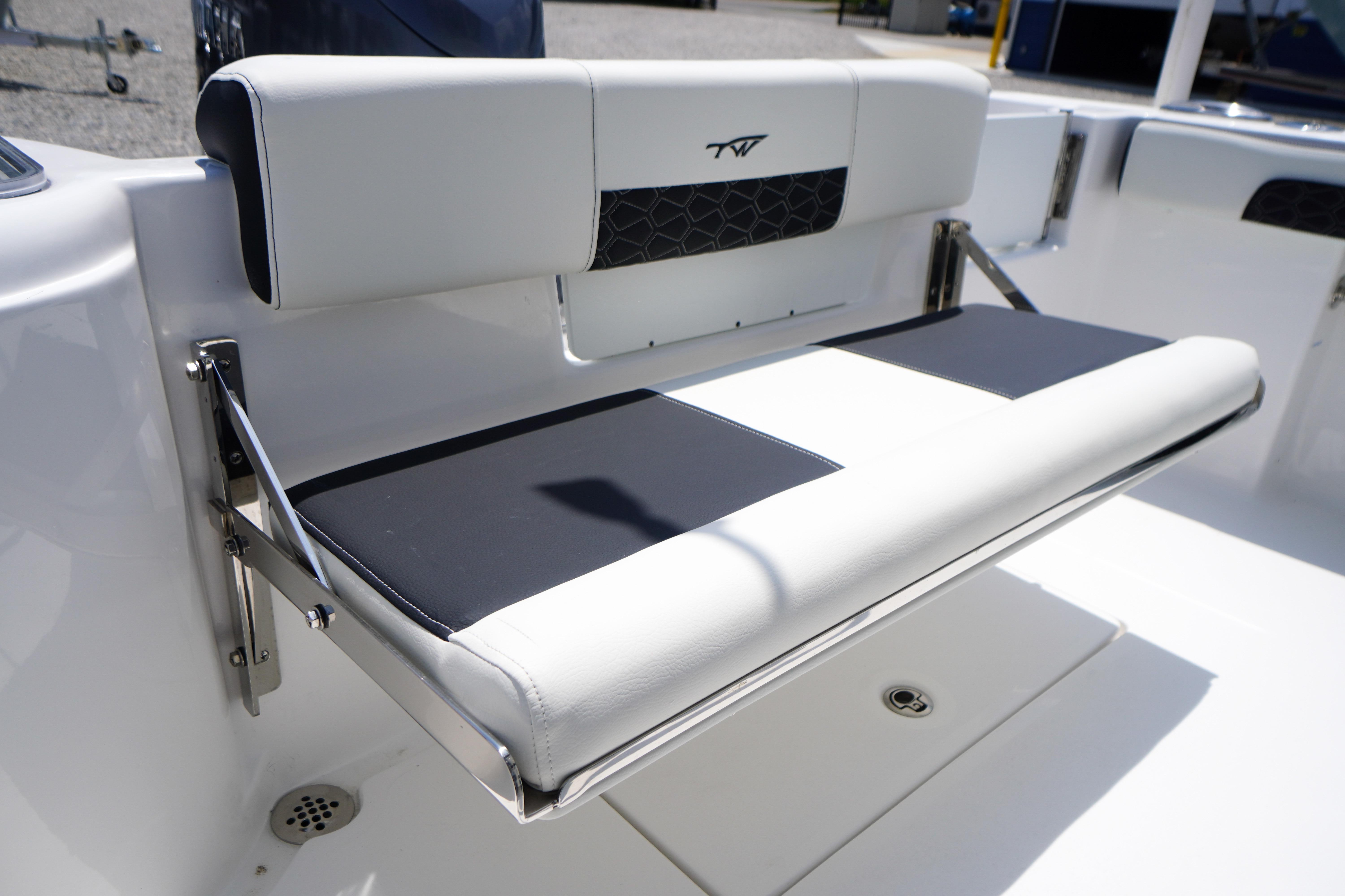 2027 Tidewater 220 CC Adventure boat seat with sleek white and black design.
