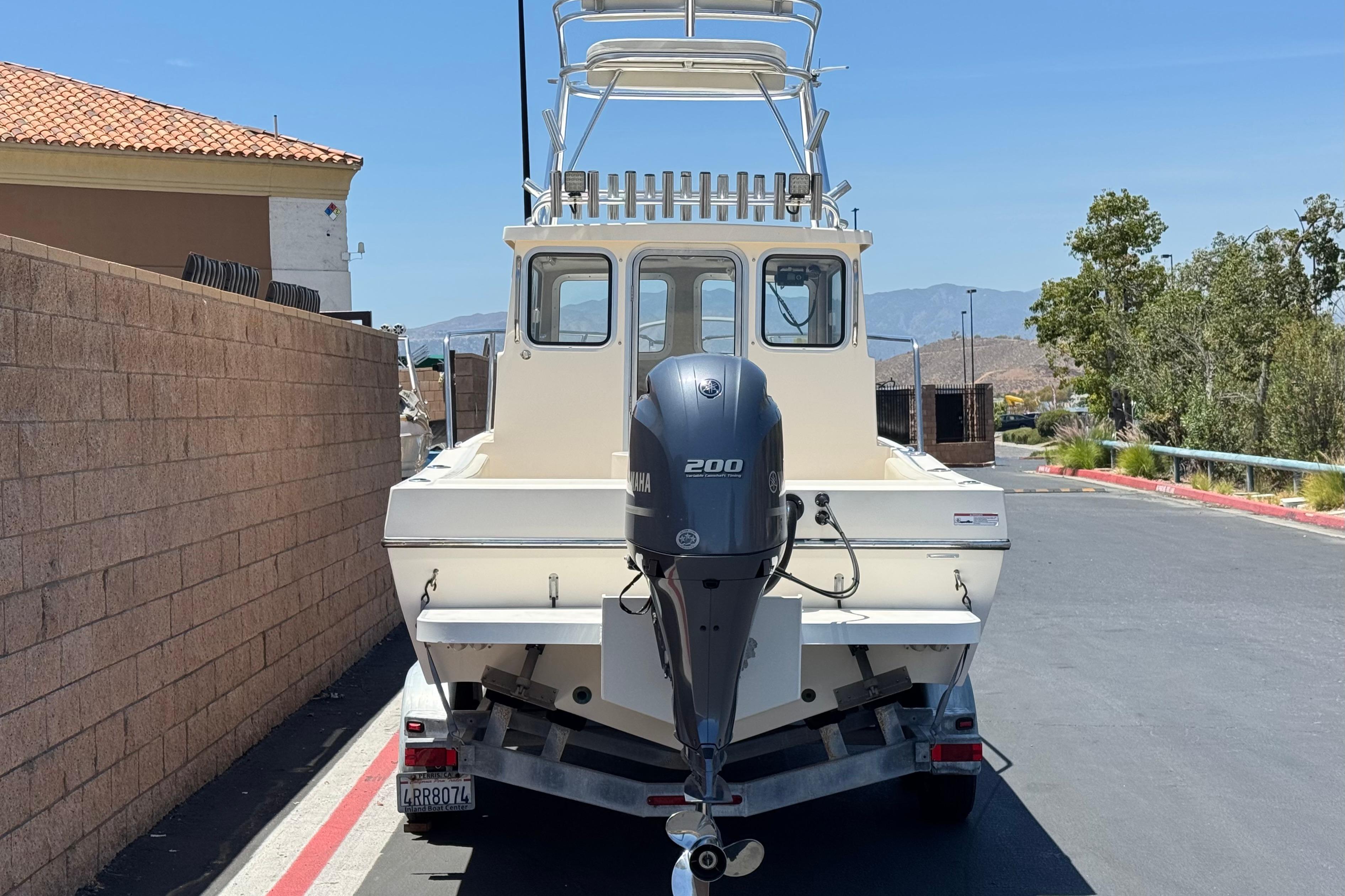 2017 Defiance Admiral 220 EX boat with Yamaha 200 engine on trailer.