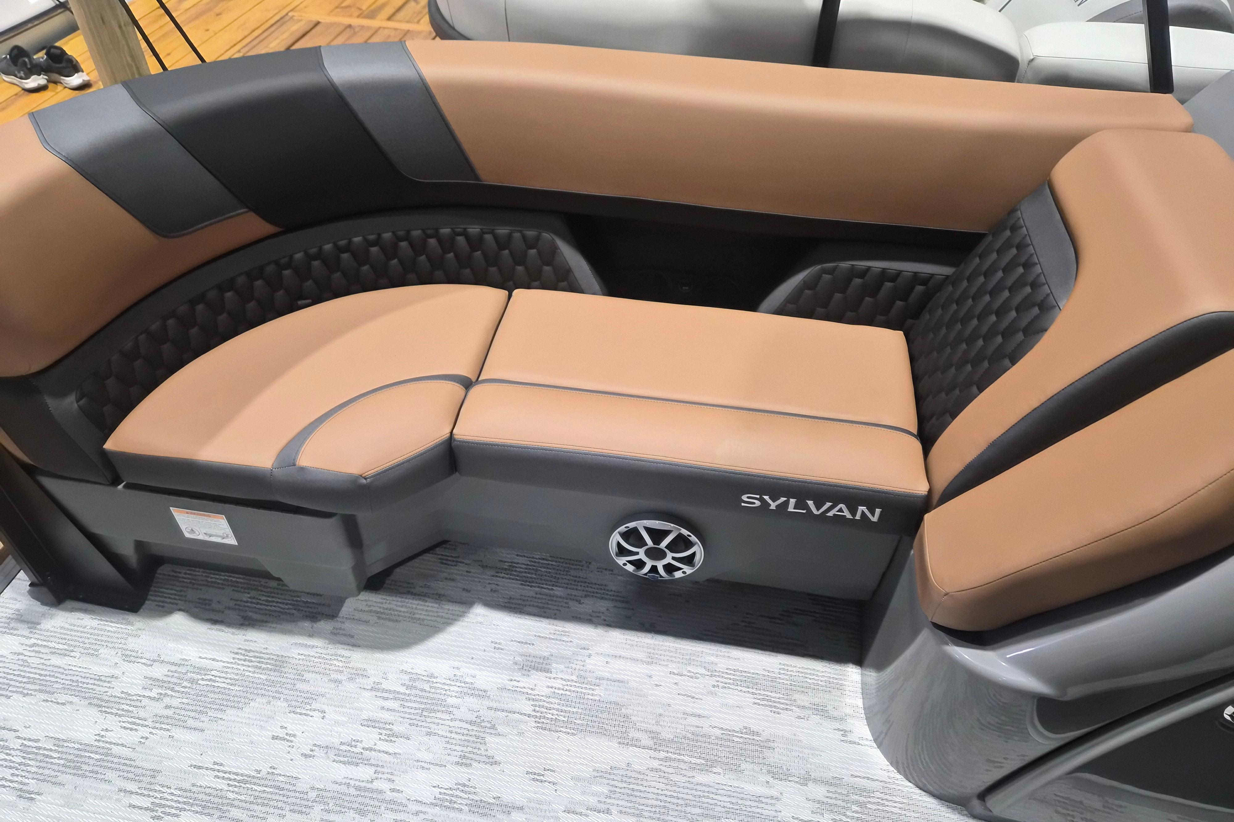 Luxurious seating in the 2026 Sylvan L3 SLZ boat, featuring elegant brown and black upholstery.