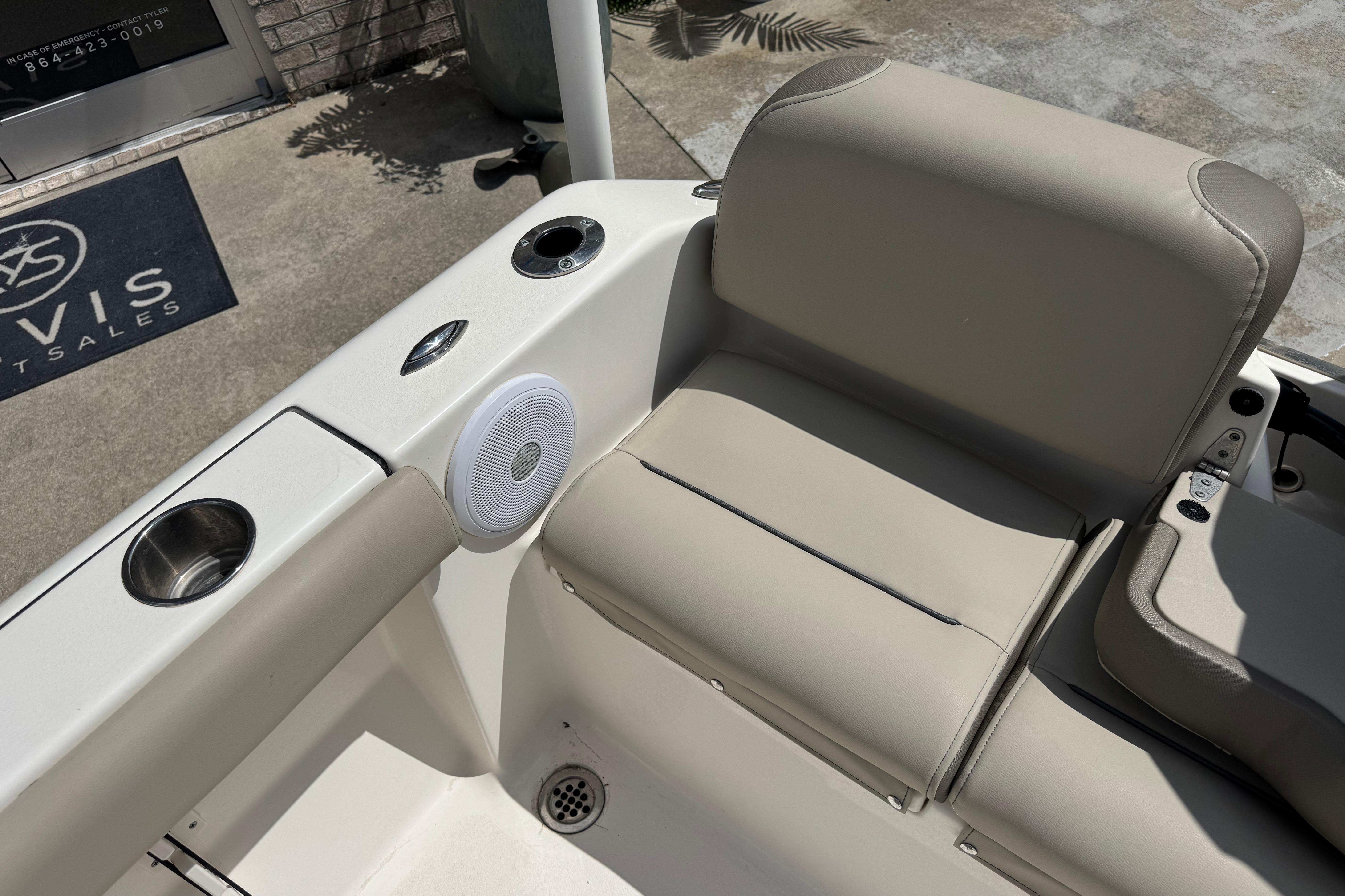 2022 Key West 189 FS boat interior with beige seating and cup holders.