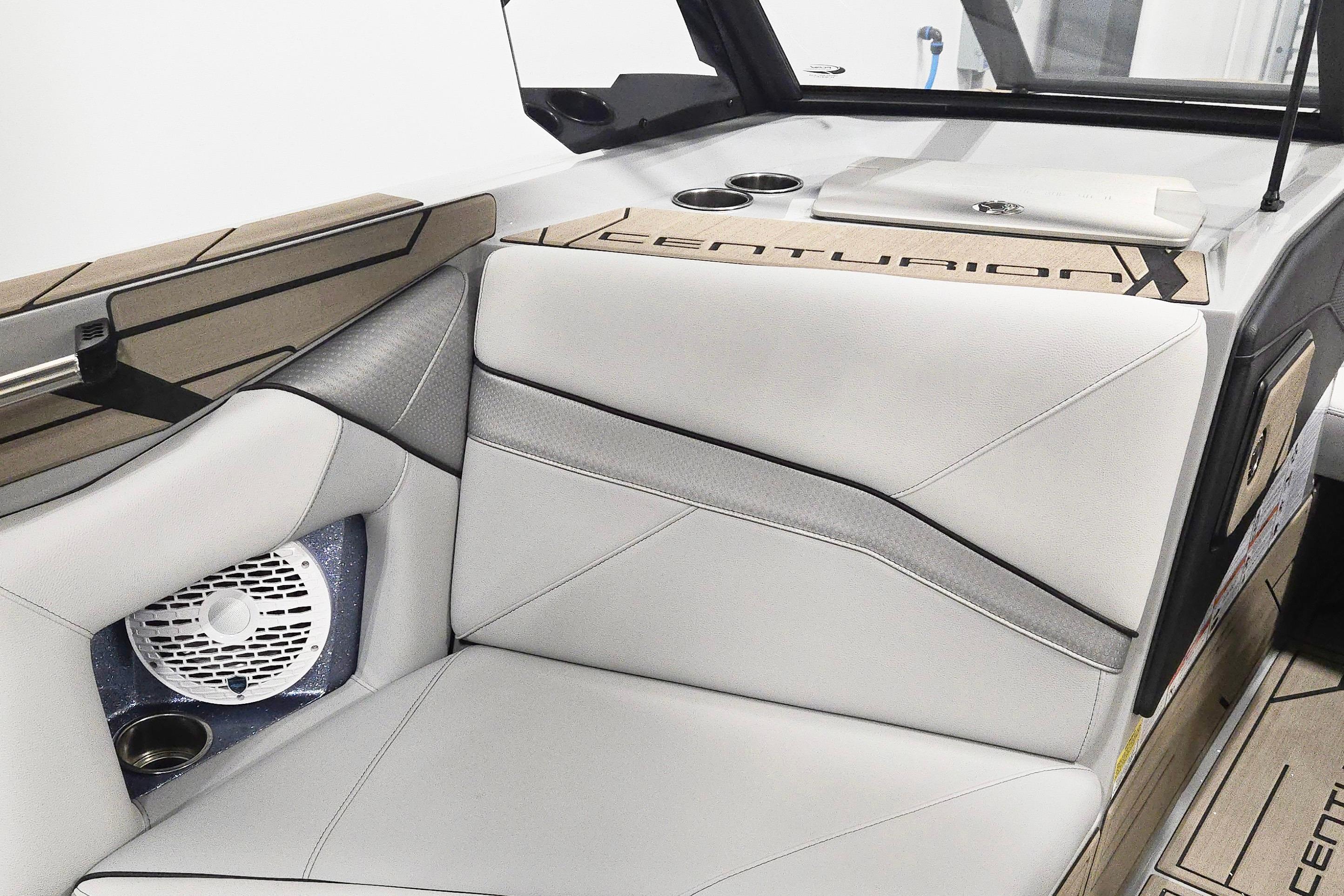 2026 Centurion Nv243 boat interior with sleek seating and integrated speaker system.