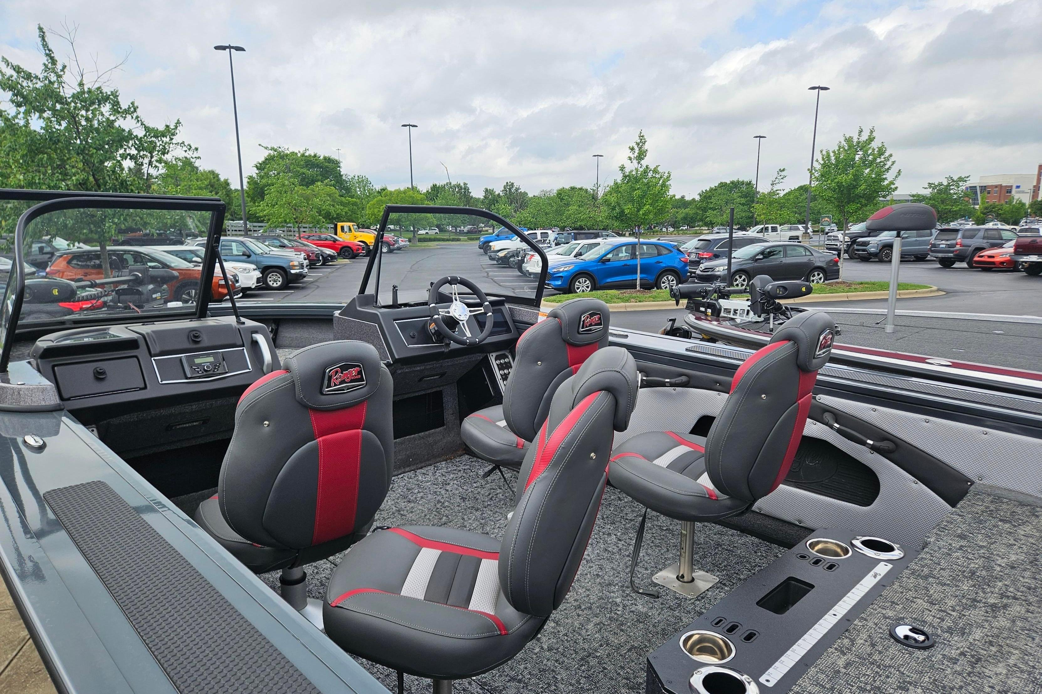 2025 Ranger VX1888 WT boat interior with seating and dashboard in a parking lot.