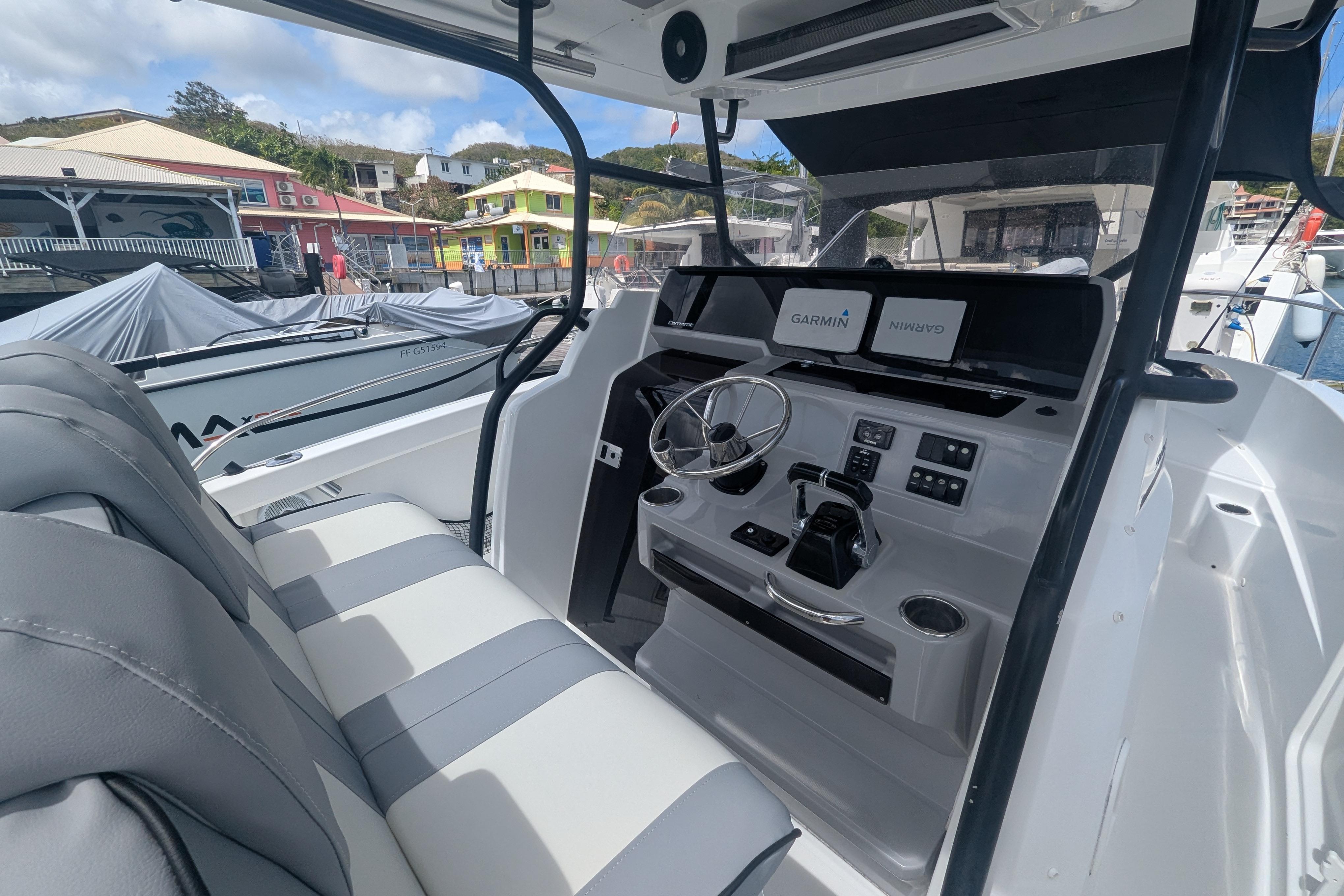 2019 Jeanneau Cap Camarat 9.0 CC boat interior with modern dashboard and seating.