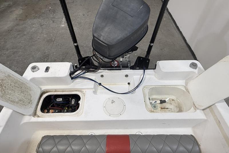 1996 Century 1800 Center Console boat interior with engine and storage compartments.