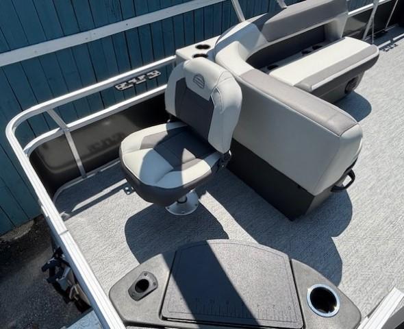 2026 Sun Tracker Bass Buggy 18 DLX pontoon boat interior with seating and deck details.