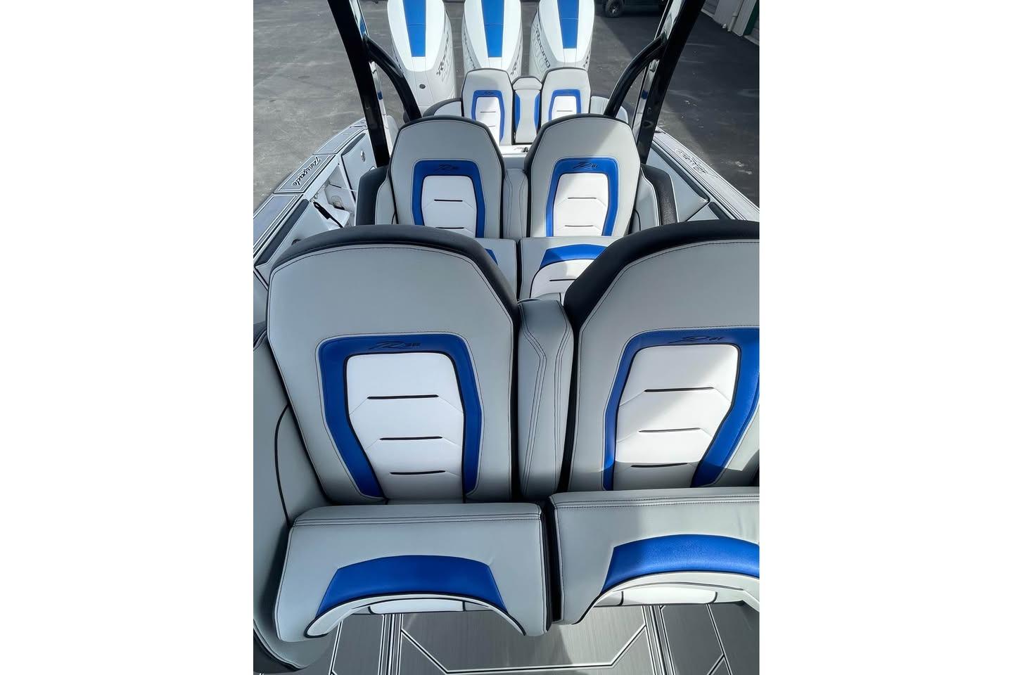 2026 Renegade 38 Open boat interior with stylish blue and white seating.