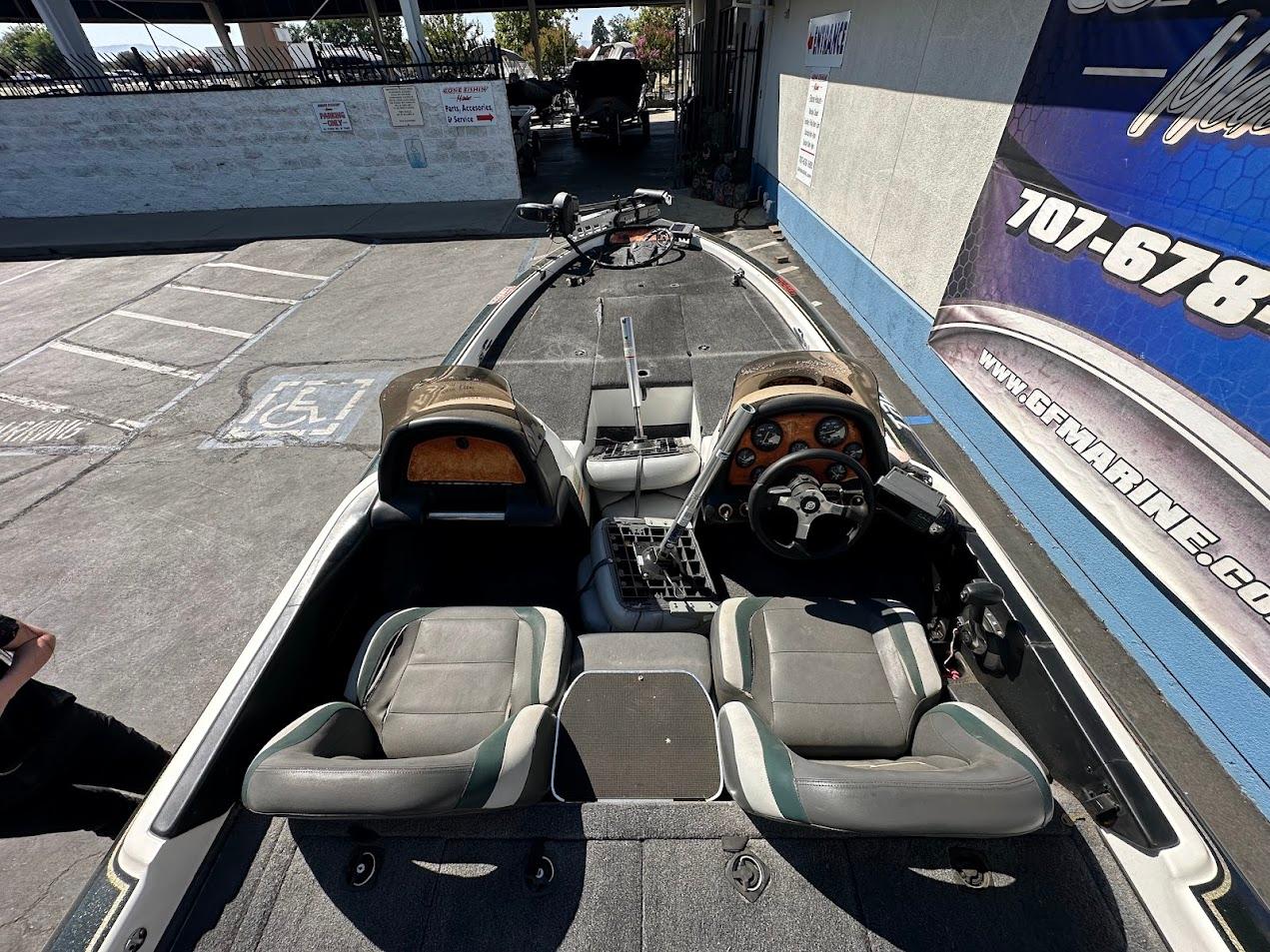 1999 Fisher 21 FX DC boat interior with dual seats and steering wheel.