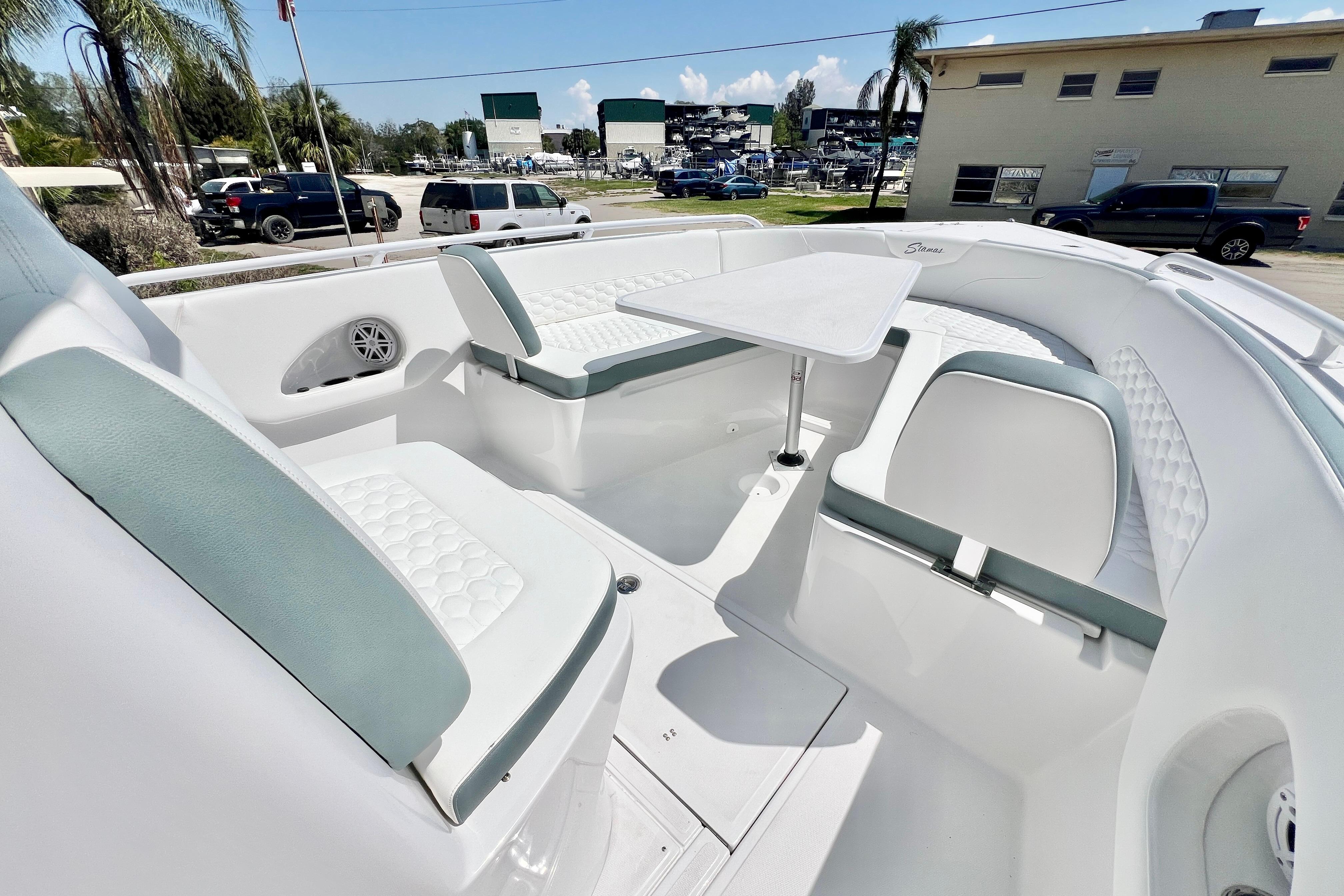 2026 Stamas 31T Aventura boat interior with white seating and table.