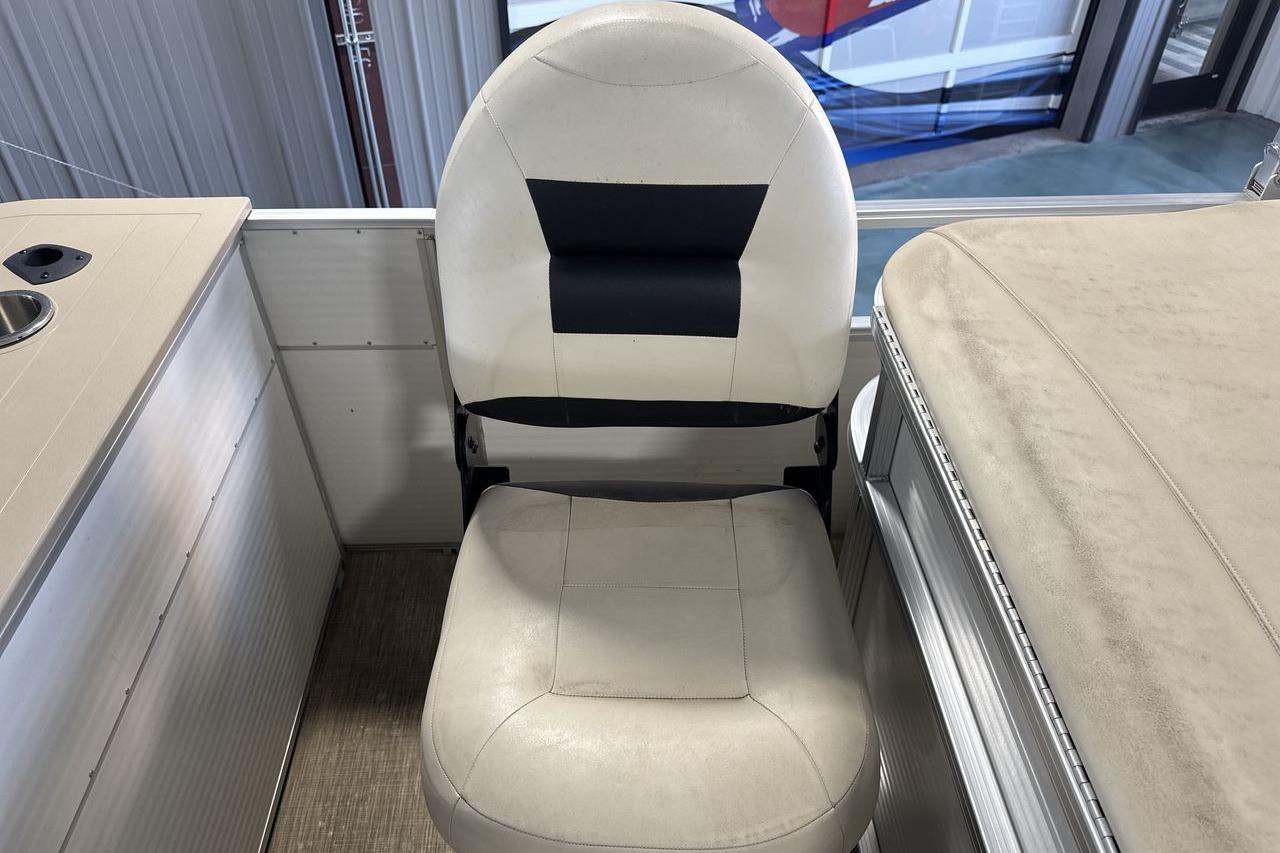 2018 Landau Alure 212 Fish boat interior with cushioned seating and table.