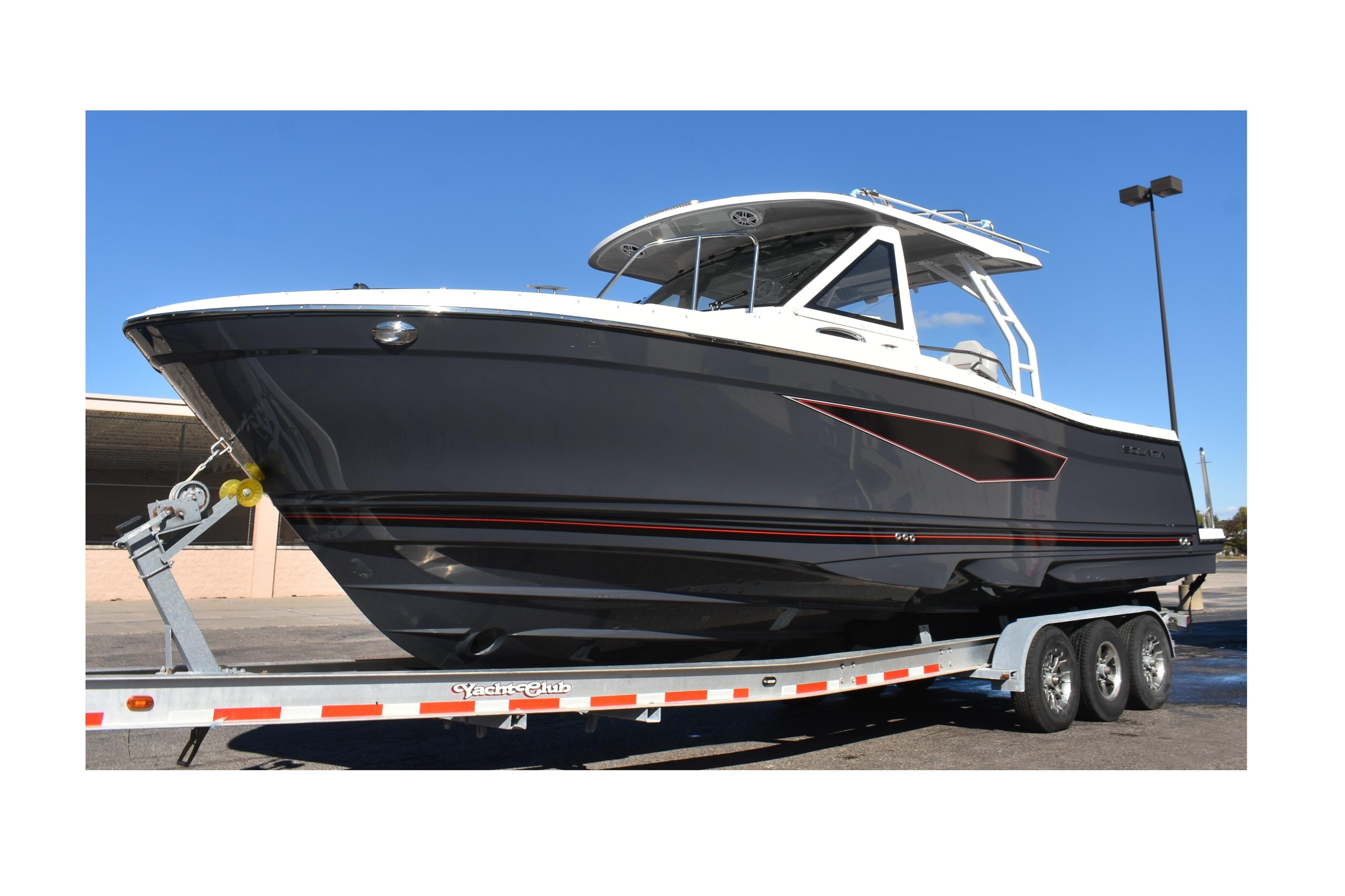 2025 Solara S-310 CW boat on trailer, sleek design, parked outdoors.