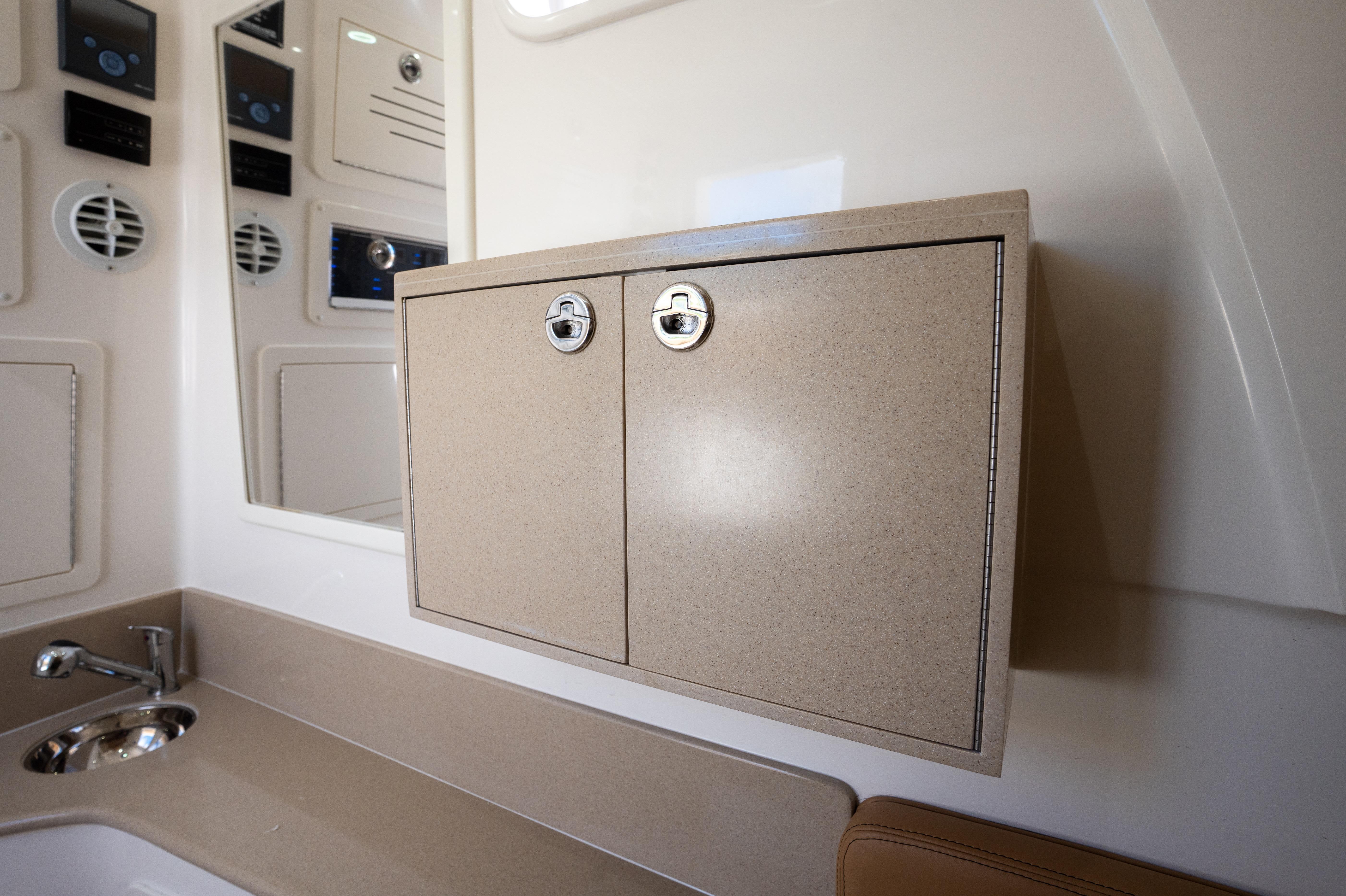 Interior of 2026 Blackwater 41 Performance Fish boat with beige cabinetry and modern fixtures.