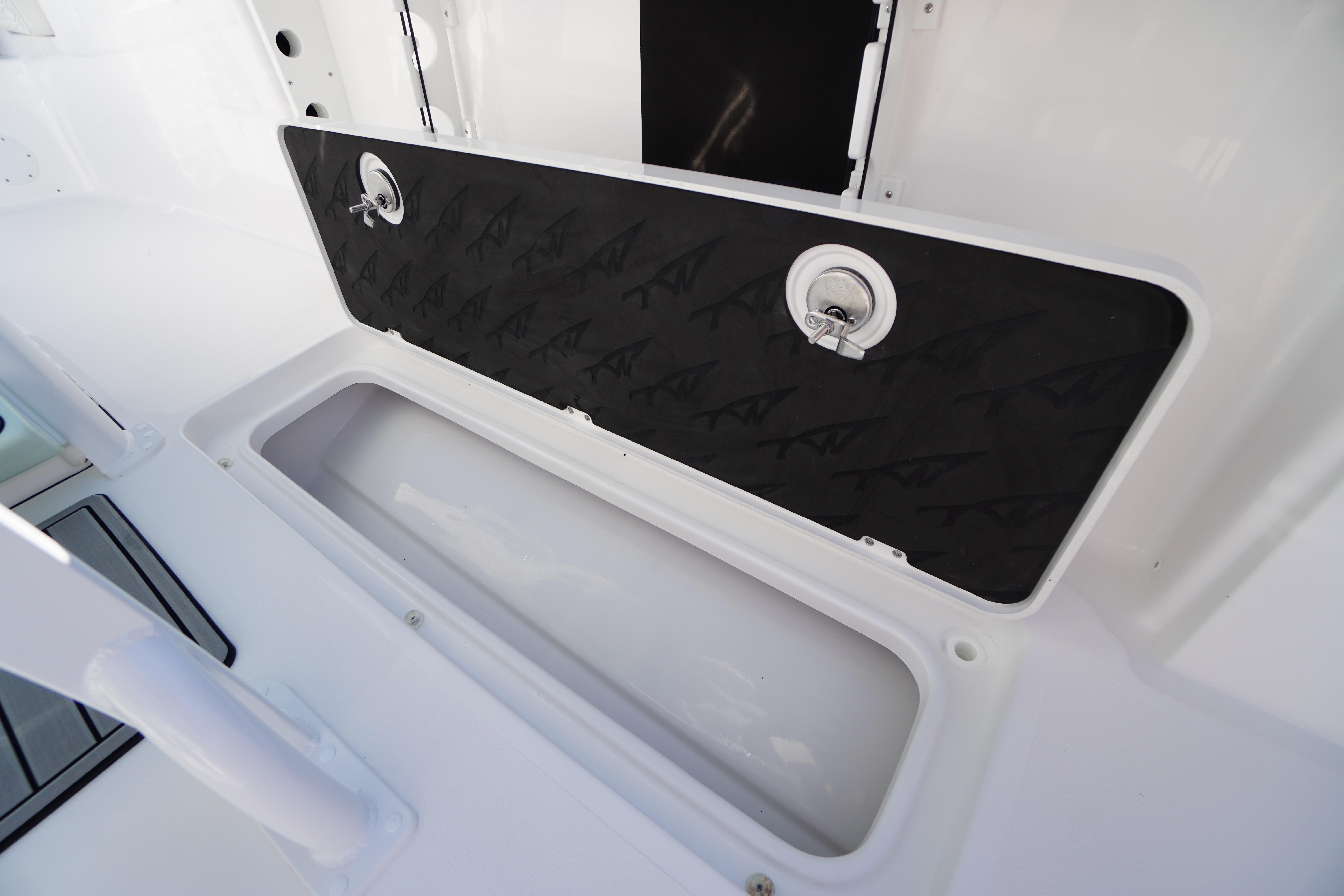 2026 Tidewater 272 LXF boat storage compartment with secure latch and sleek design.