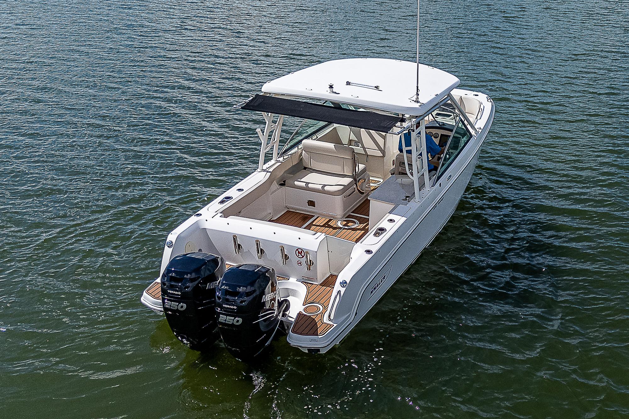 2018 Boston Whaler 270 Vantage boat on water, featuring dual engines.