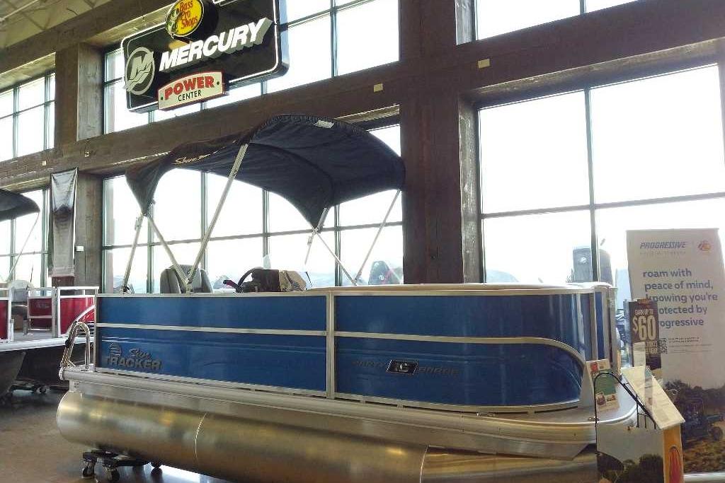 2026 Sun Tracker Party Barge 16 DLX pontoon boat displayed indoors.
