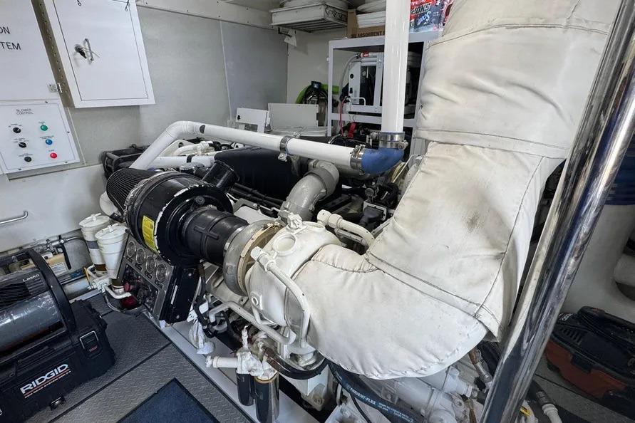 Engine room of 2004 Lazzara SC Motor Yacht, showcasing mechanical components and systems.