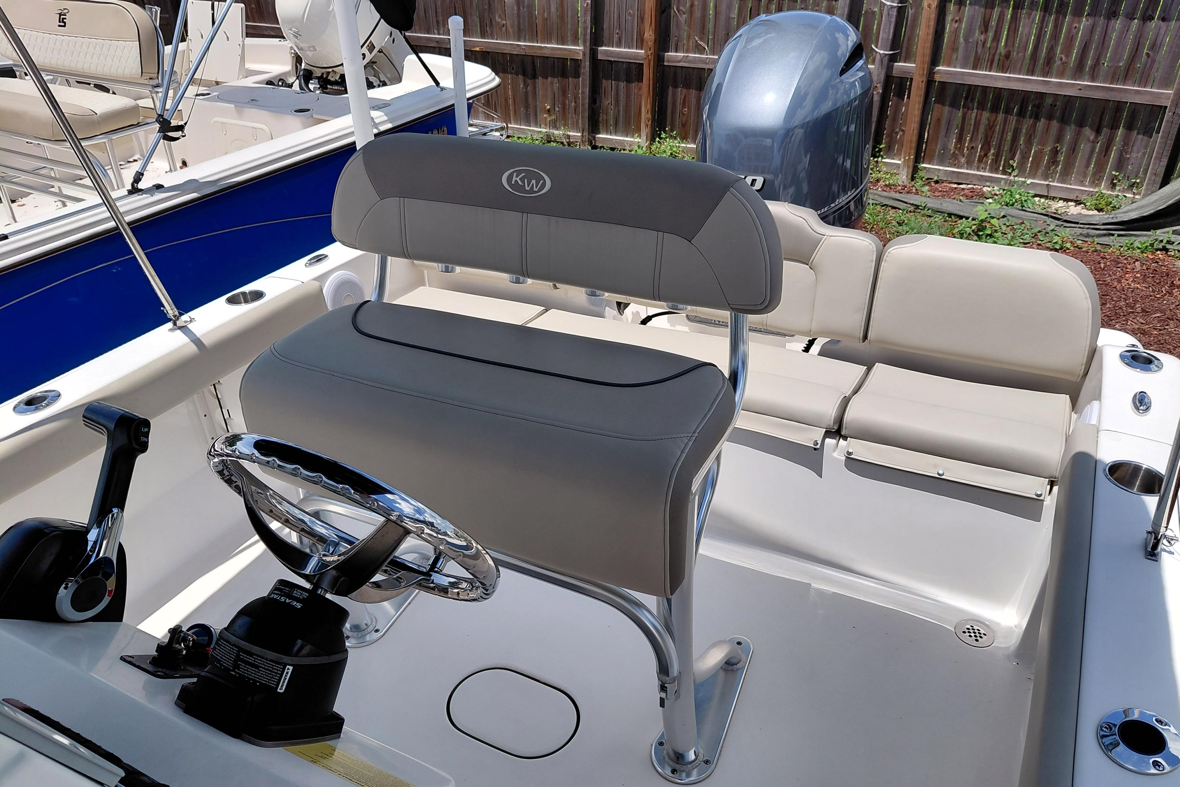 2023 Key West 189 FS boat interior with steering wheel and seating.