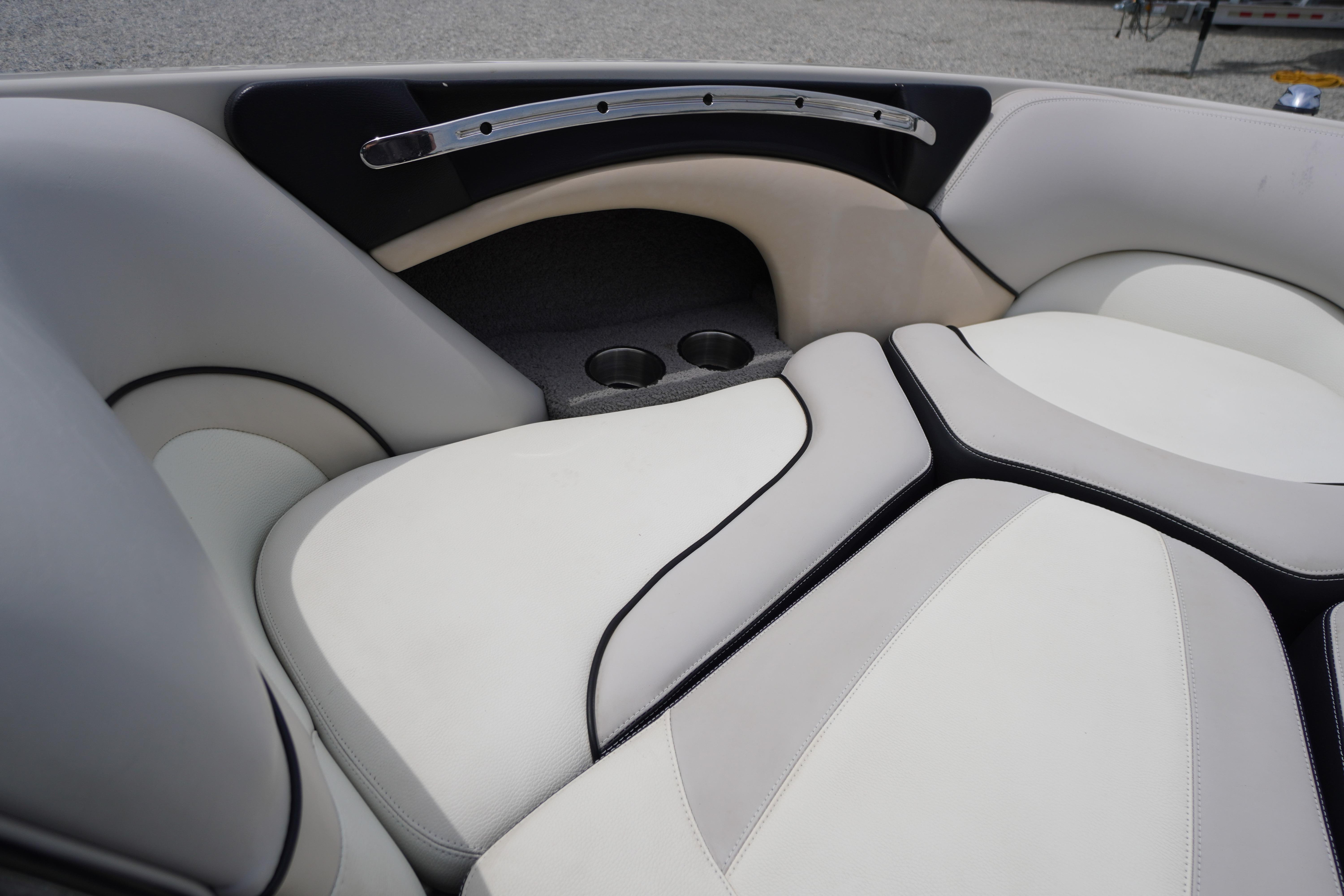 2011 Malibu Wakesetter 21 VLX interior seating with cup holders and sleek design.