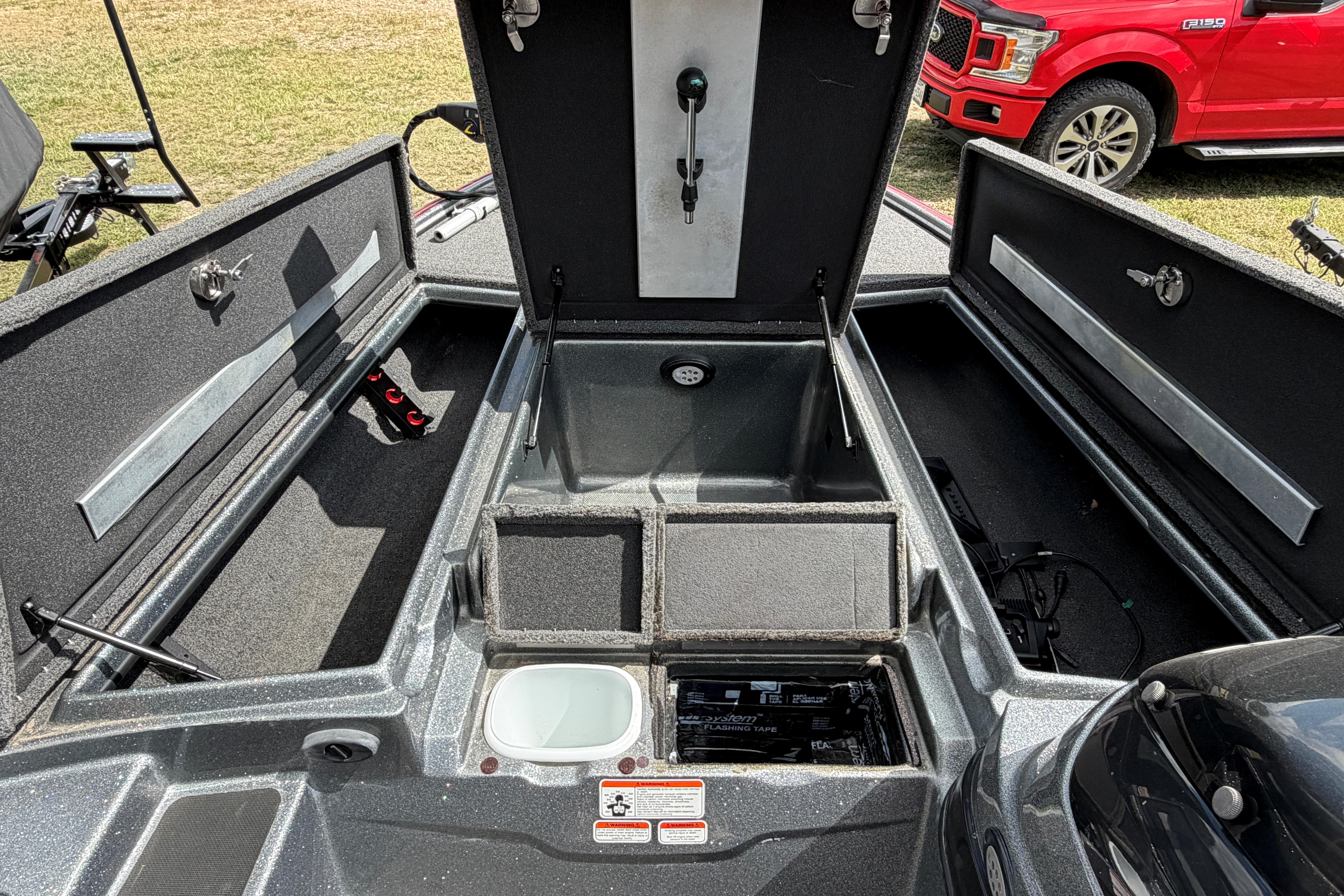 2015 Nitro Z-8 boat interior with open storage compartments and visible equipment.