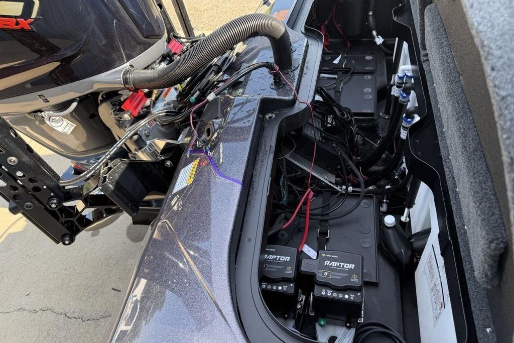 2026 Skeeter ZXE20 boat engine compartment with batteries and wiring.
