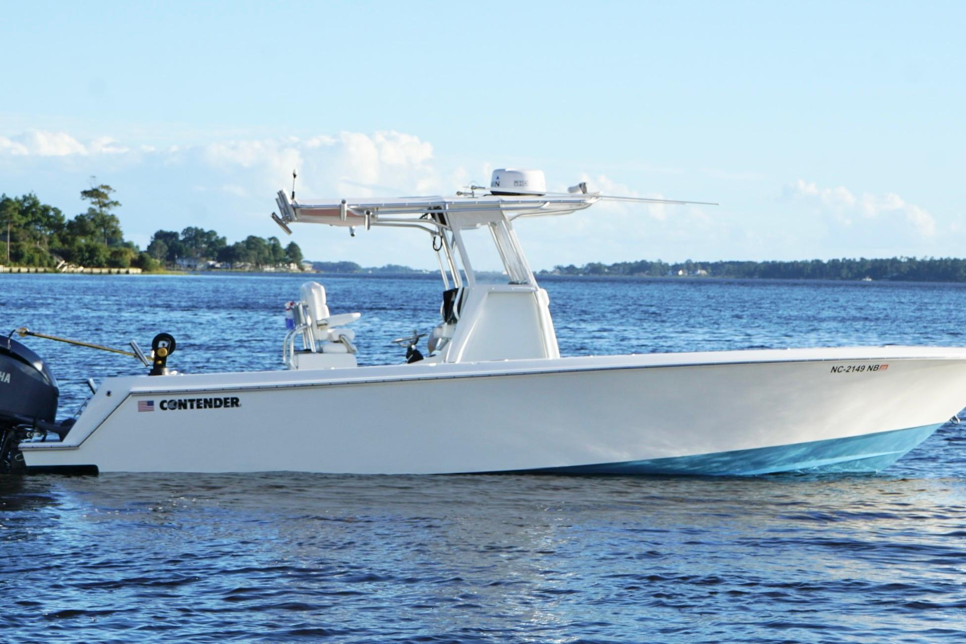 2023 Contender 30 Tournament boat on calm water, side view.