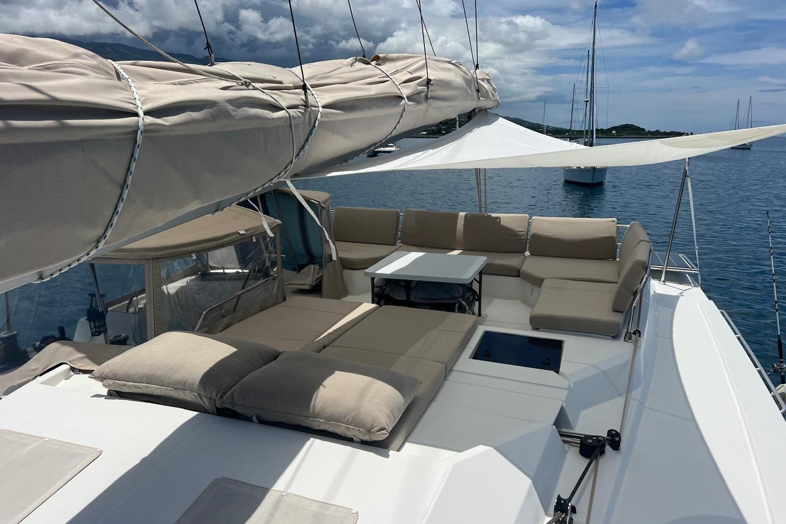 Luxurious 2022 Fountaine Pajot Elba 45 Catamaran with spacious deck and comfortable seating.