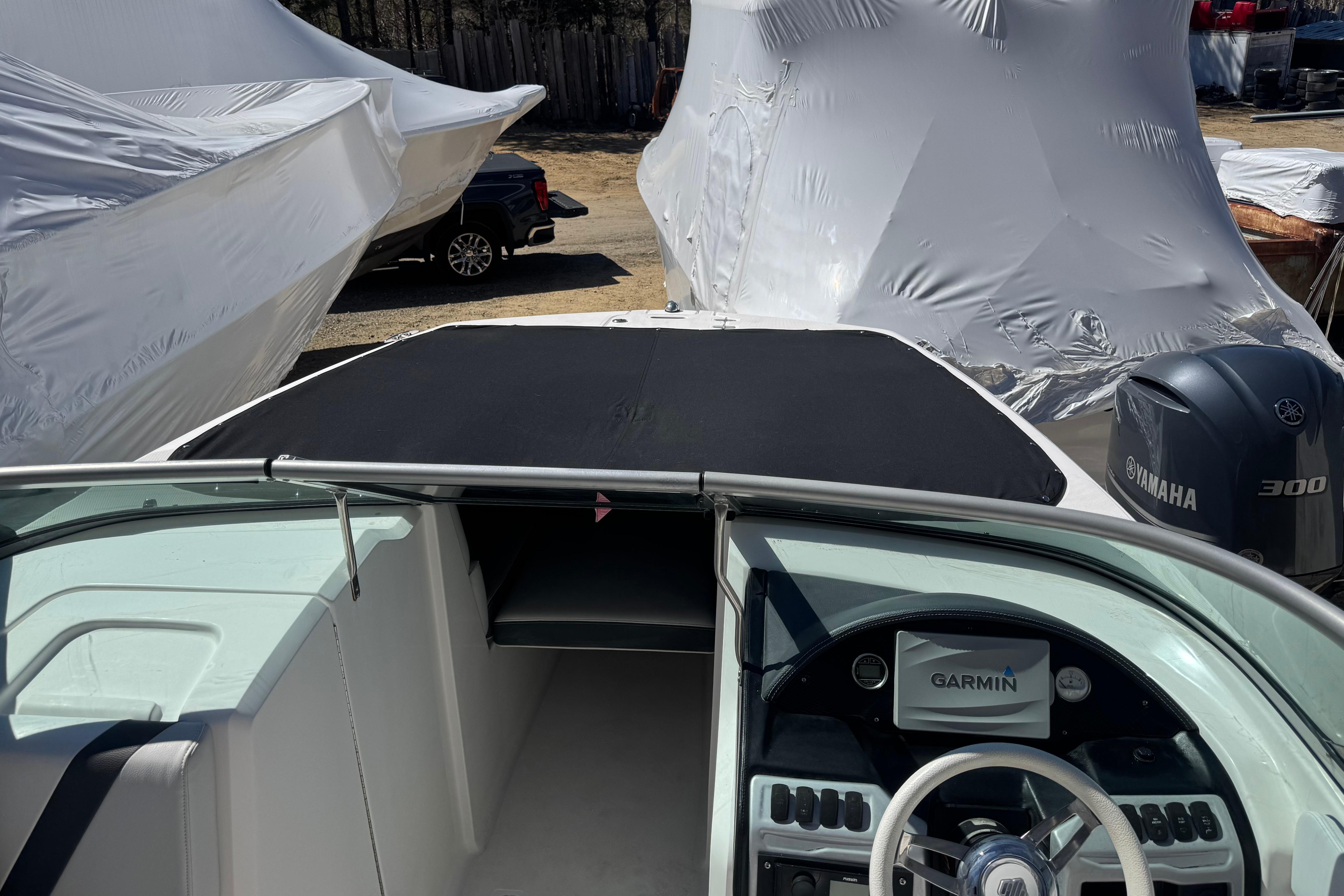 2017 Regal 23 OBX boat with Garmin navigation, Yamaha engine, and covered seating area.