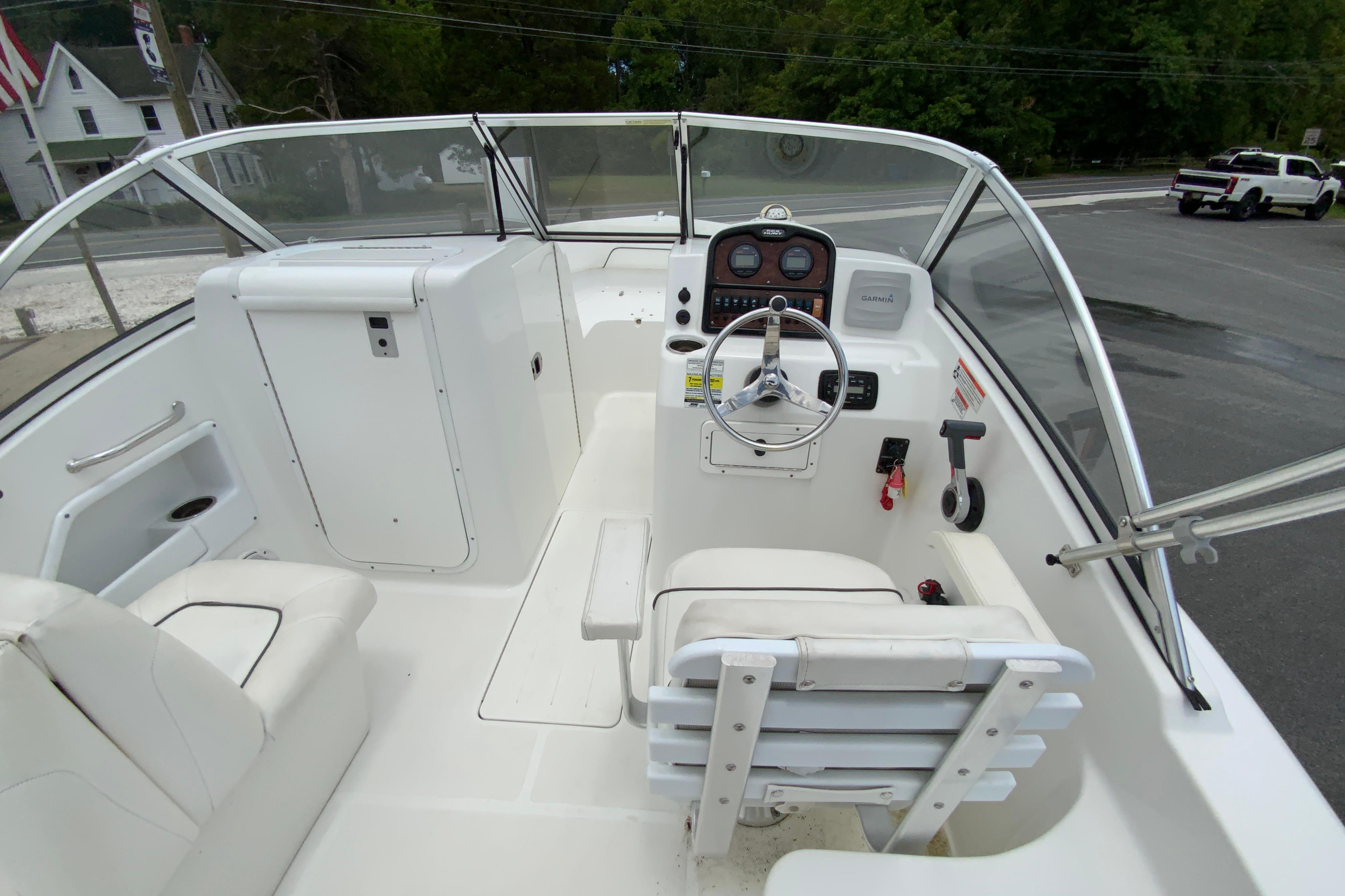 2014 Sea Hunt Escape 211 LE boat interior with steering wheel and seating.
