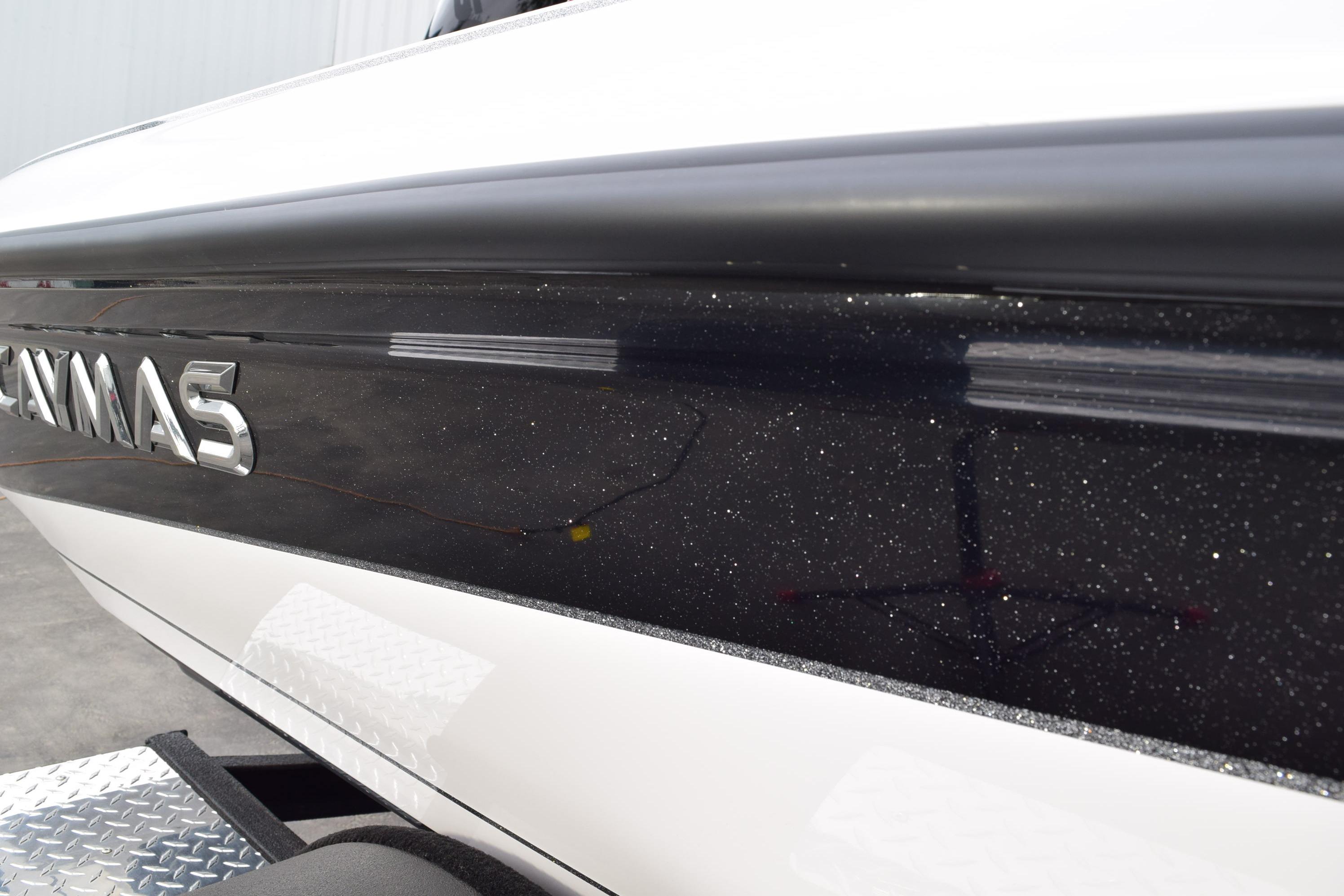 2027 Cayams CX 20 PRo boat with sleek black and white exterior design.