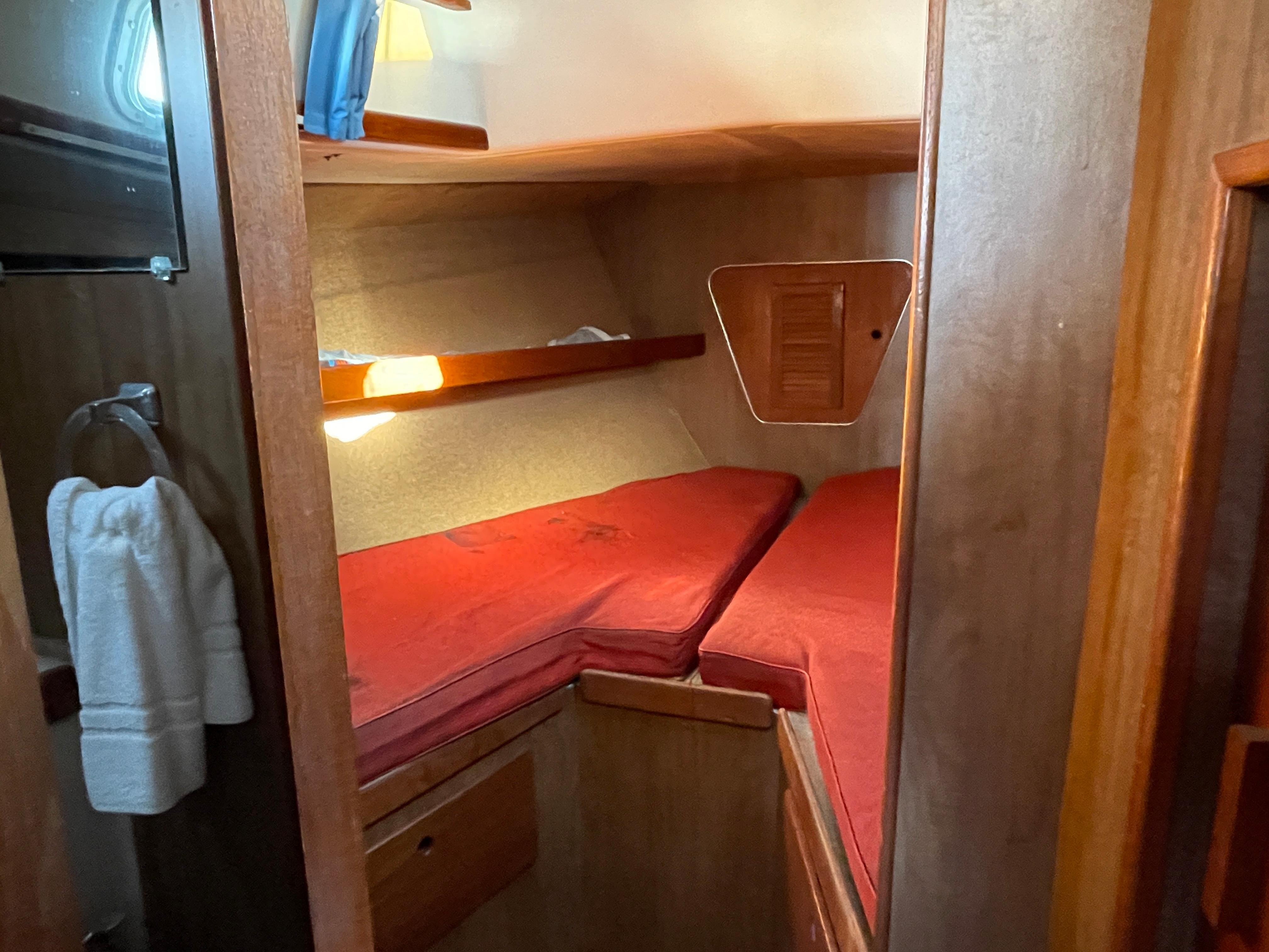 Interior of a 1971 Morgan 42 yacht with red cushions.