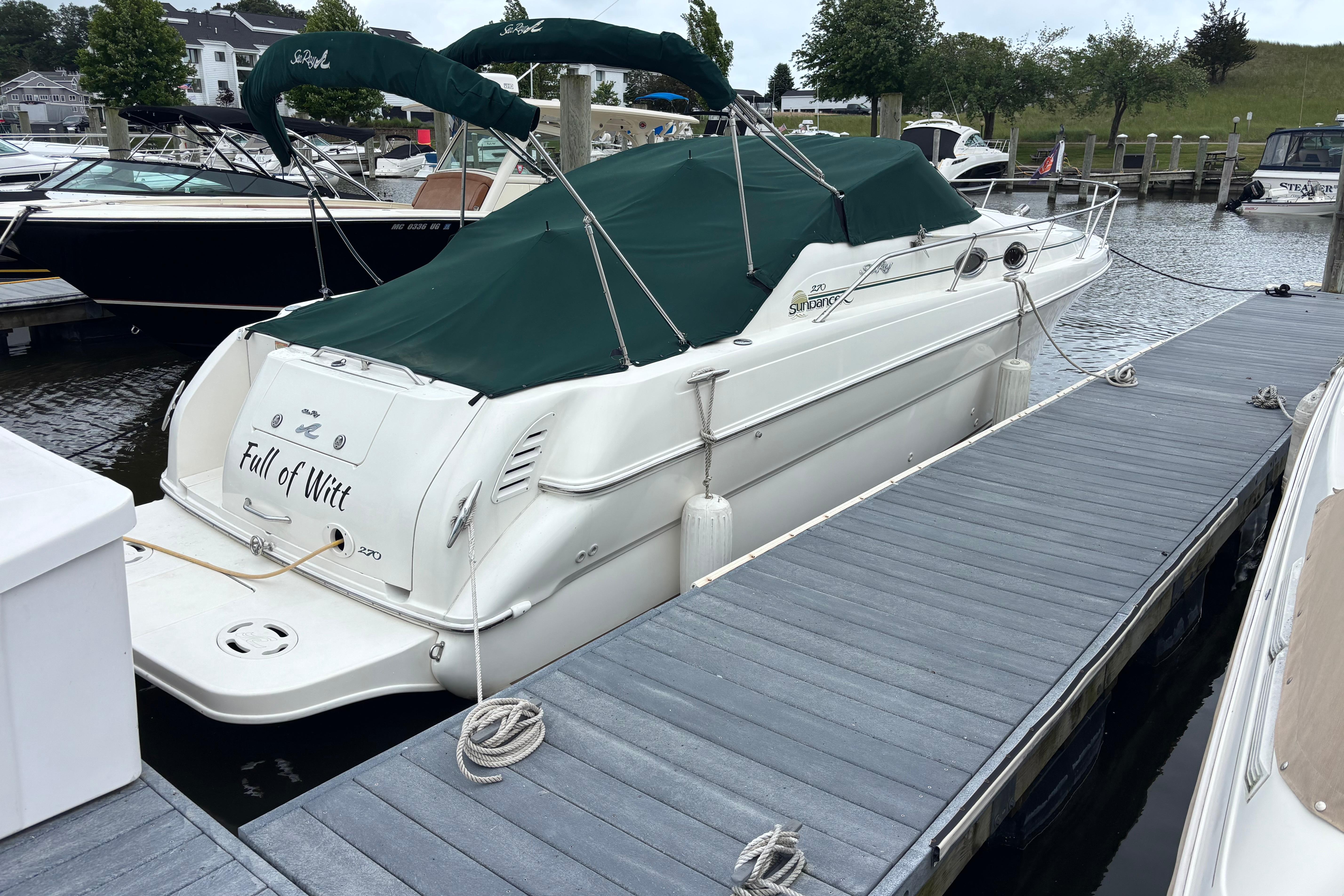 2001 Sea Ray 270 Sundancer docked with green cover, named "Full of Witt."