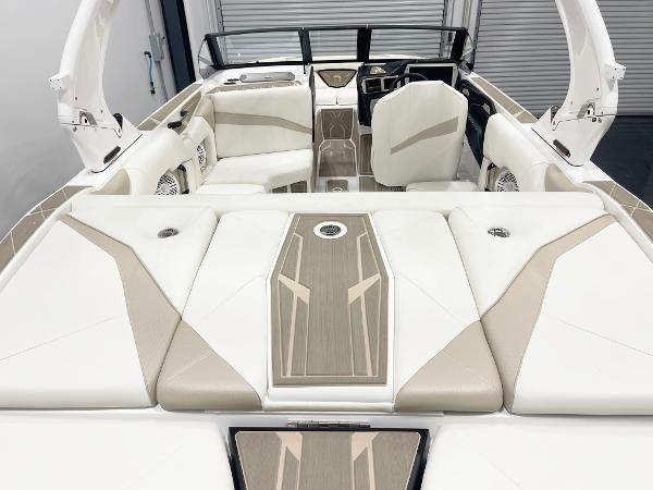2025 Centurion NV213 boat interior with beige and white seating, modern design.