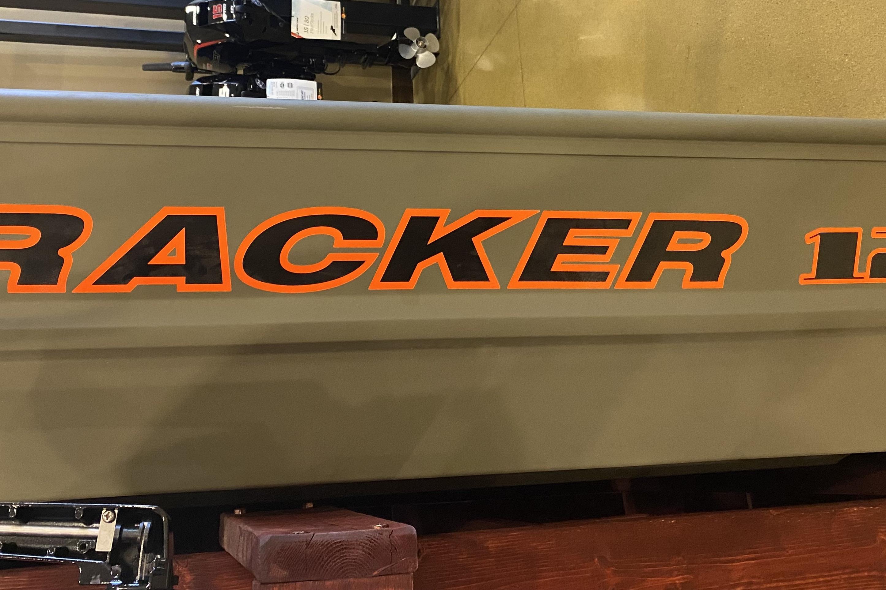 2026 Tracker Grizzly 12 Jon boat with bold orange lettering on the side.