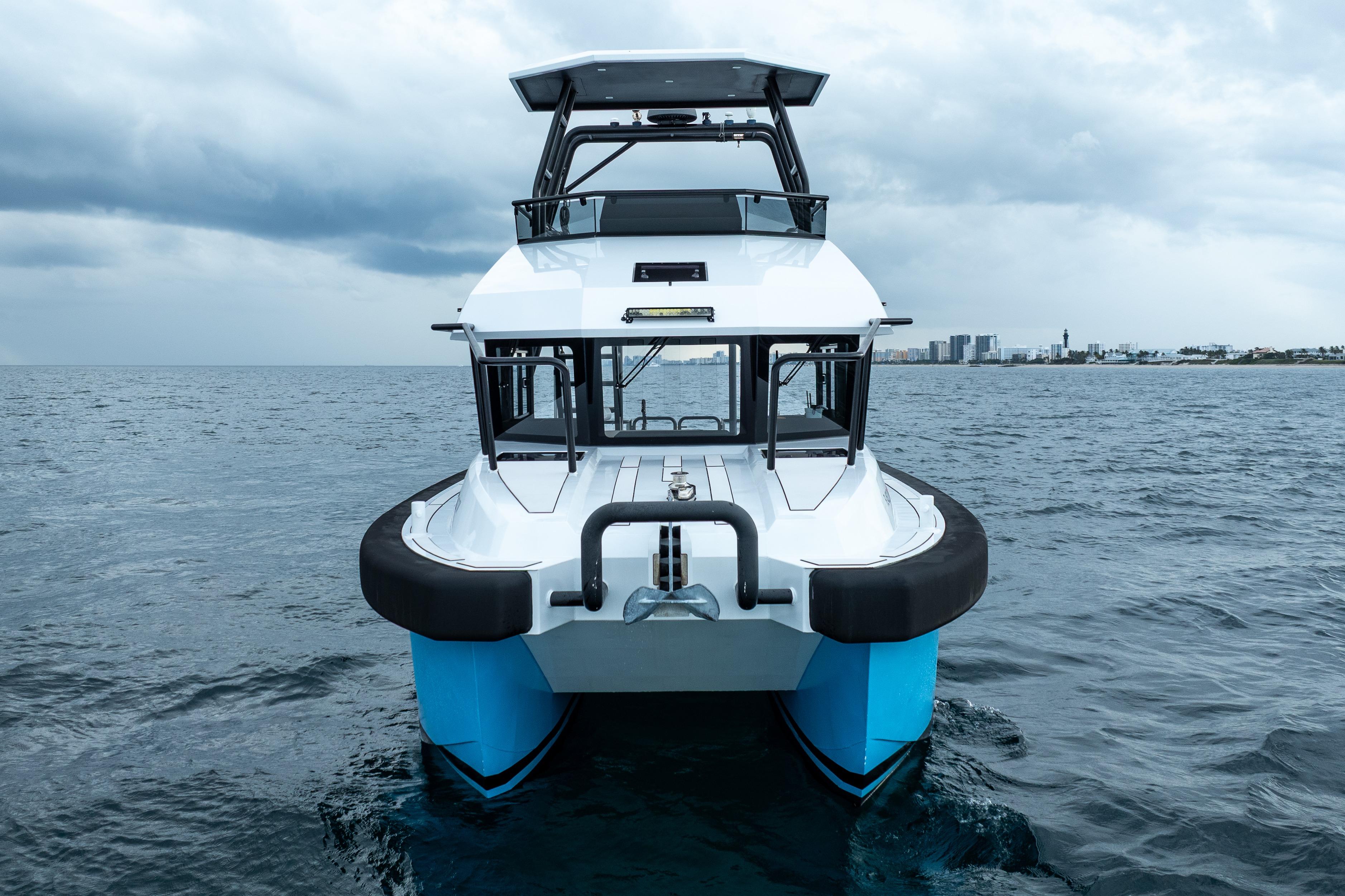2023 Vandal 46 Explorer boat on open sea under cloudy sky.