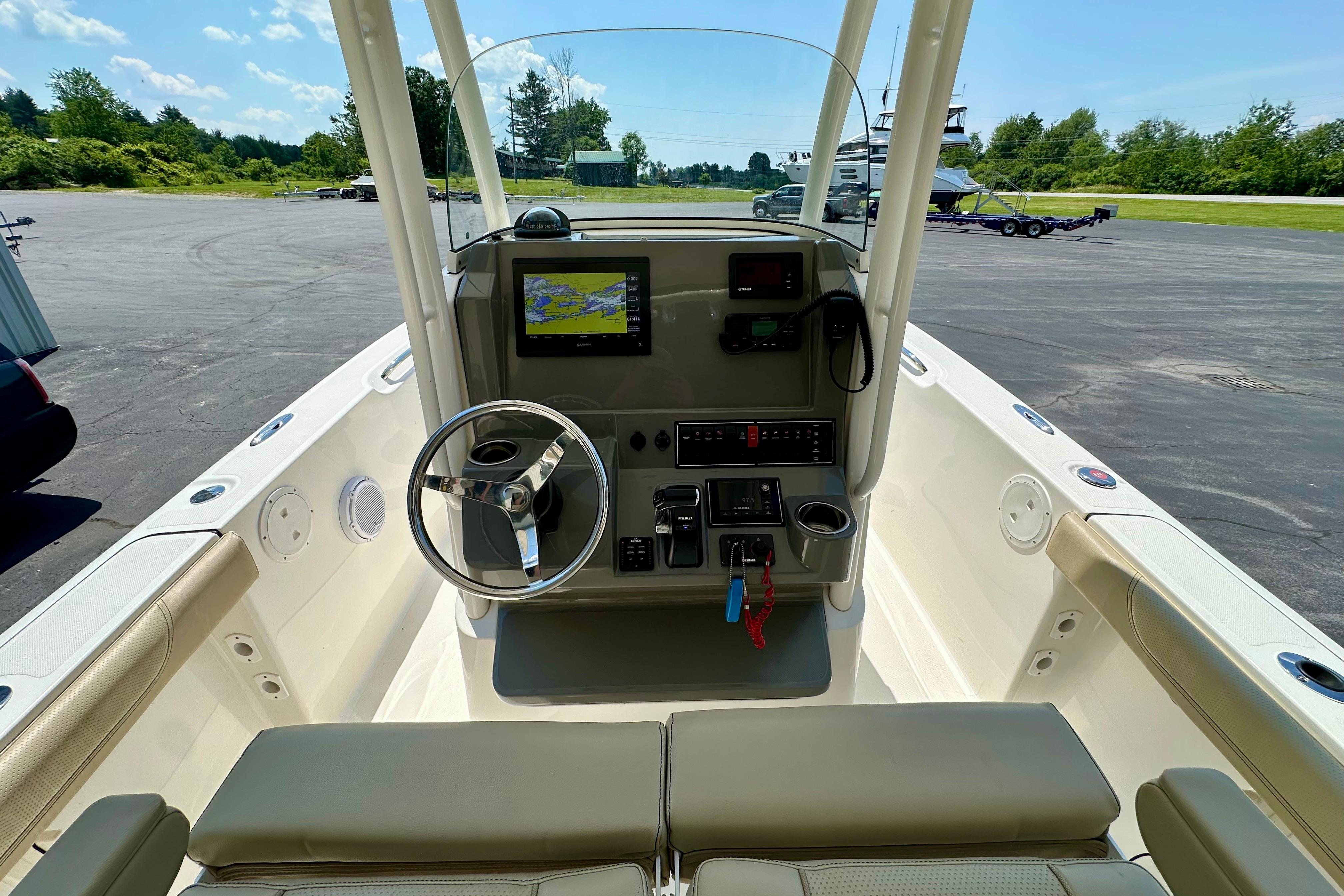 2020 Pursuit C 238 Center Console boat interior with steering wheel and navigation display.