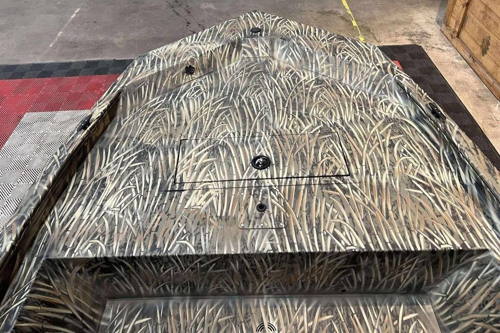 2026 Tracker Grizzly 1648 SC boat with camouflage pattern on deck.