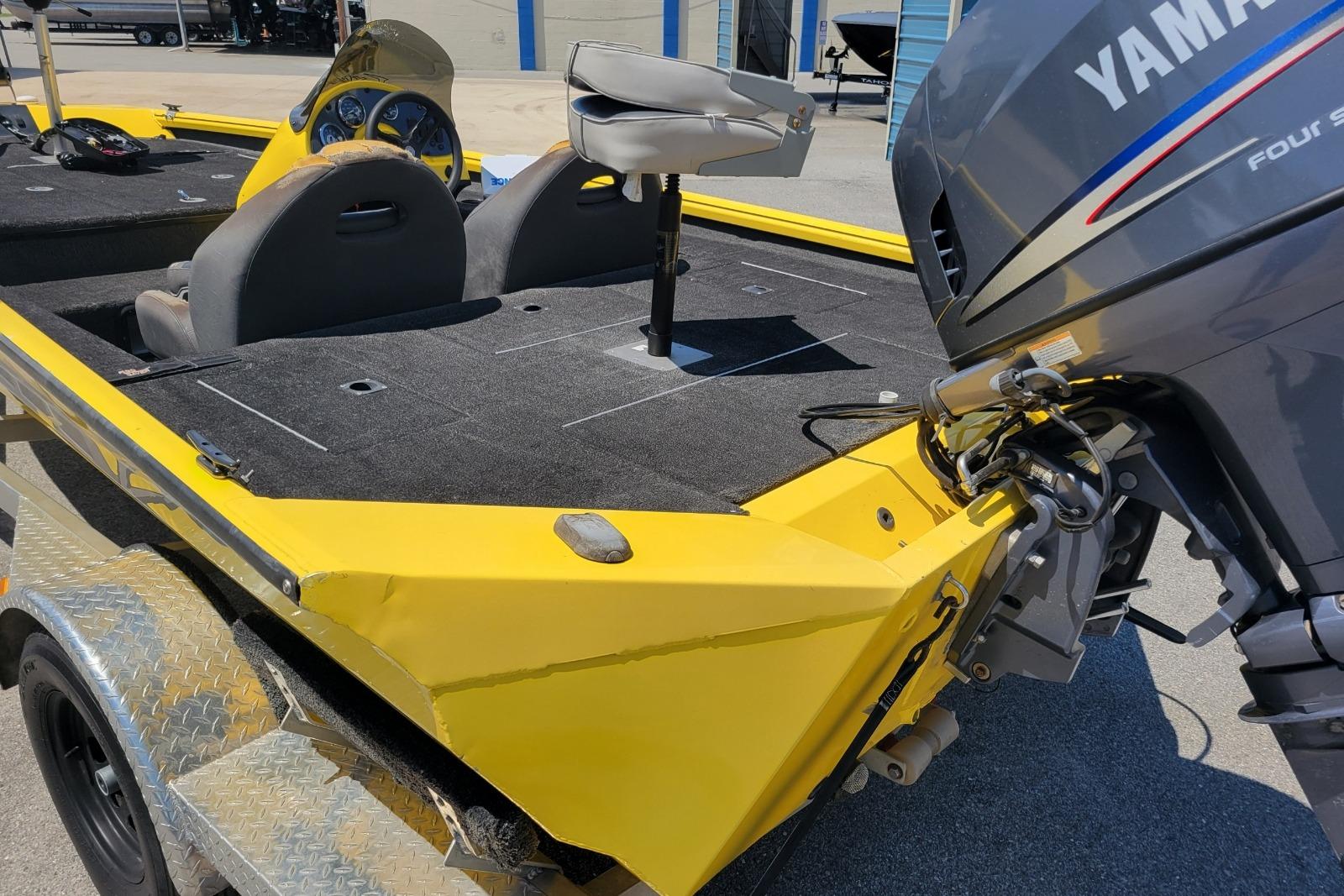 Yellow Excel 1751 F4 boat with Yamaha engine, 2011 model, on a trailer.