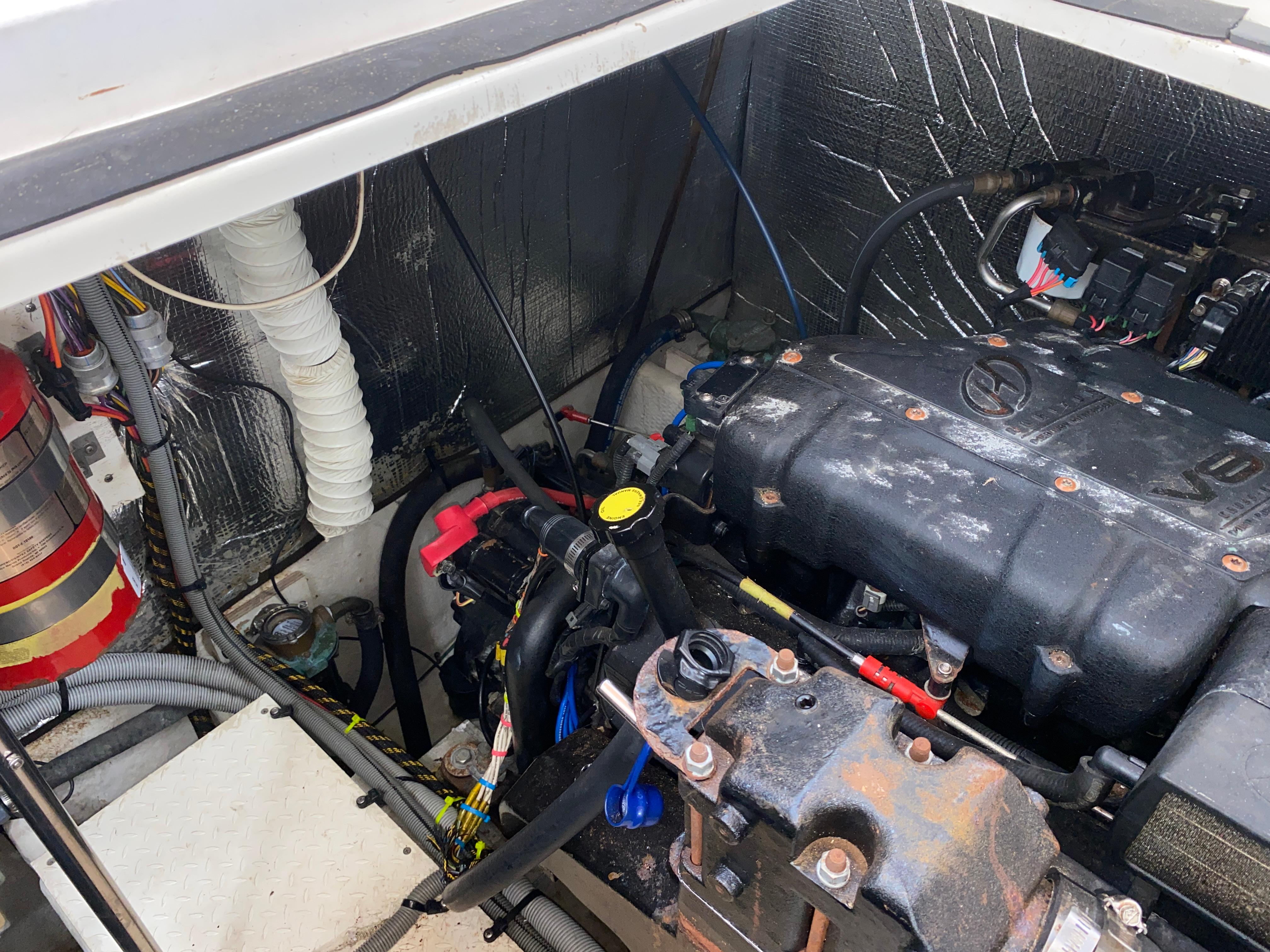 Engine compartment of a 2000 Cruisers 3672 boat, showing mechanical components and wiring.