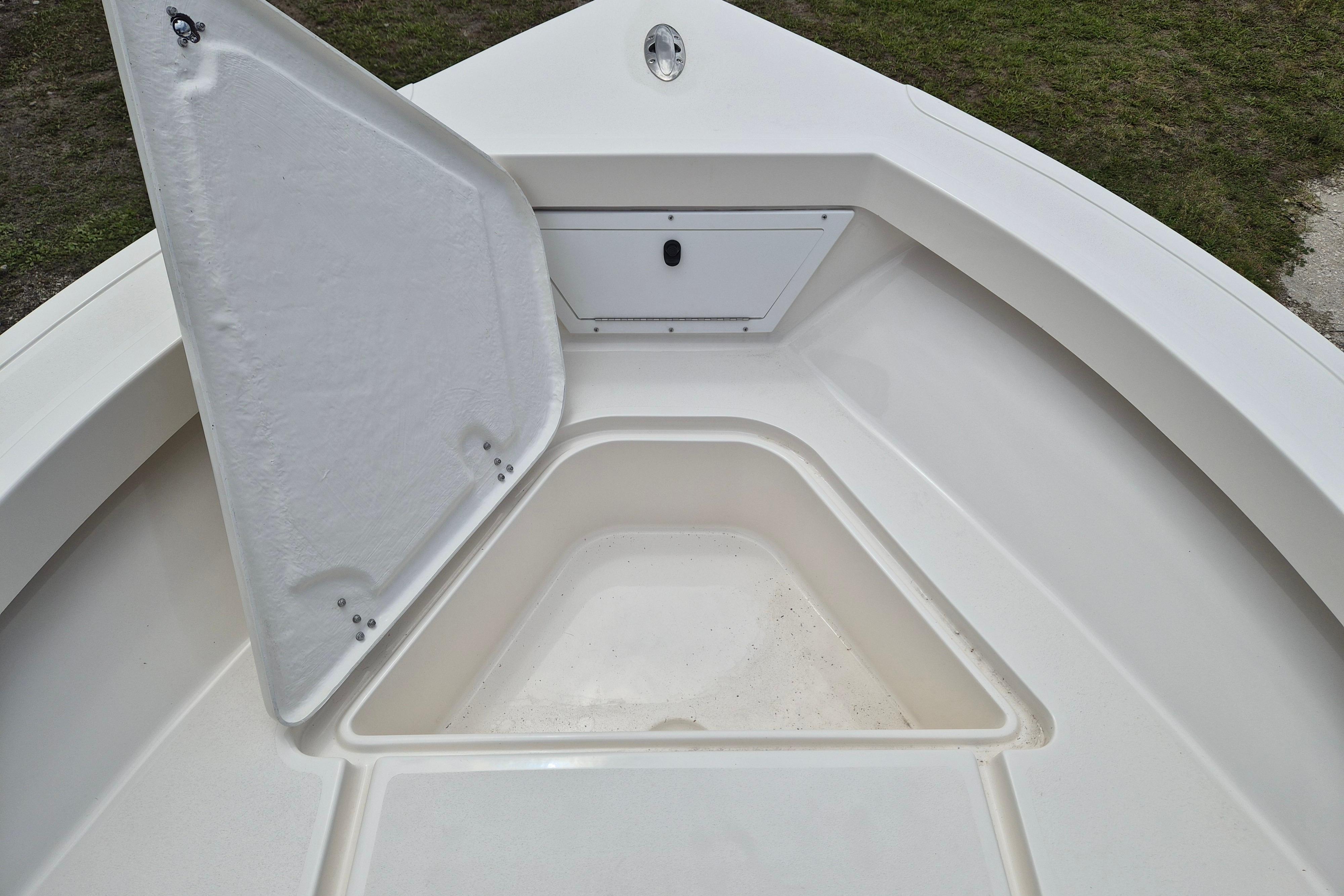 Open storage compartment on 2026 Defiance Catalina 190 boat deck.