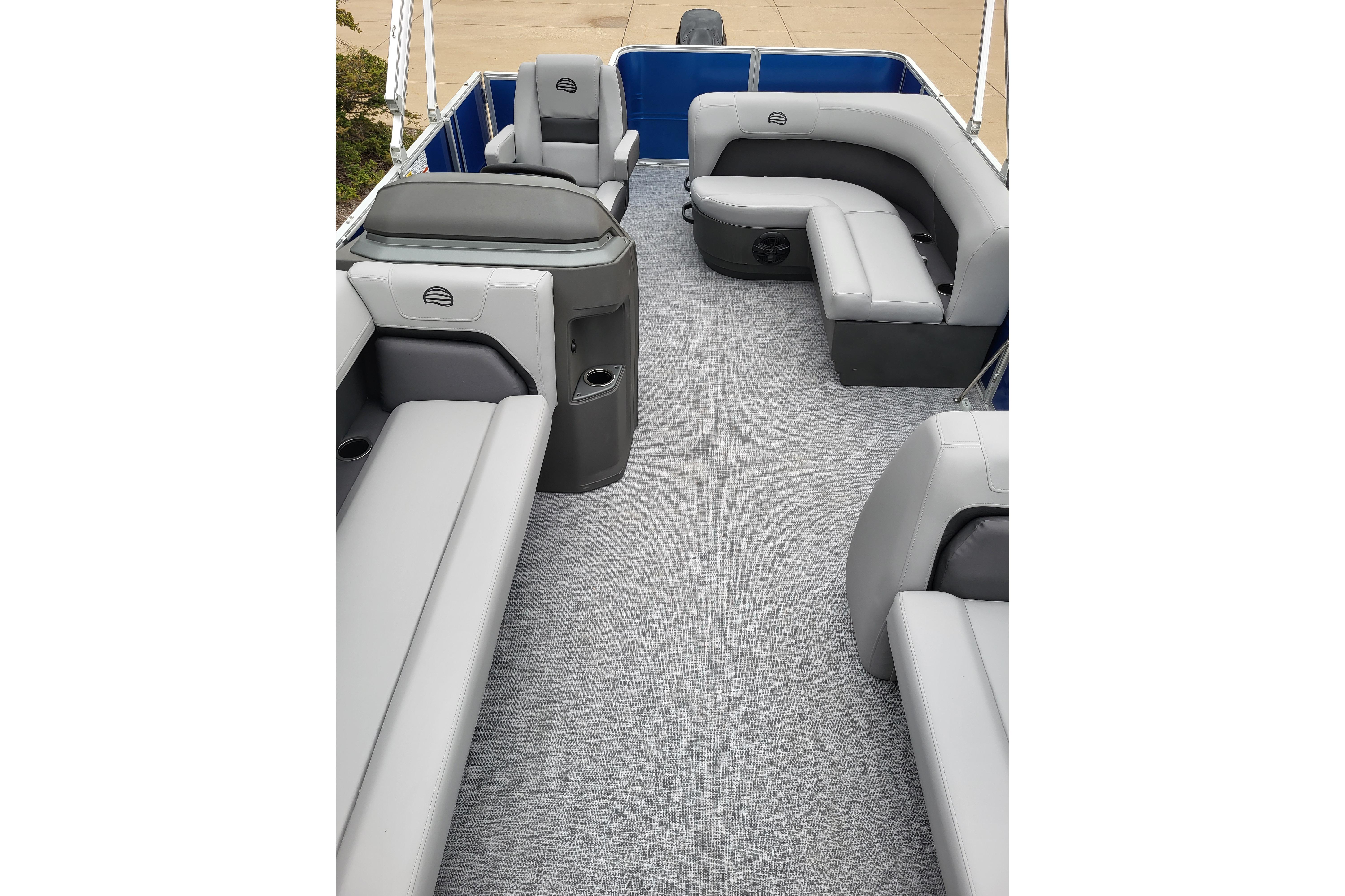 2026 Sun Tracker Party Barge 18 DLX interior with gray seating and spacious layout.