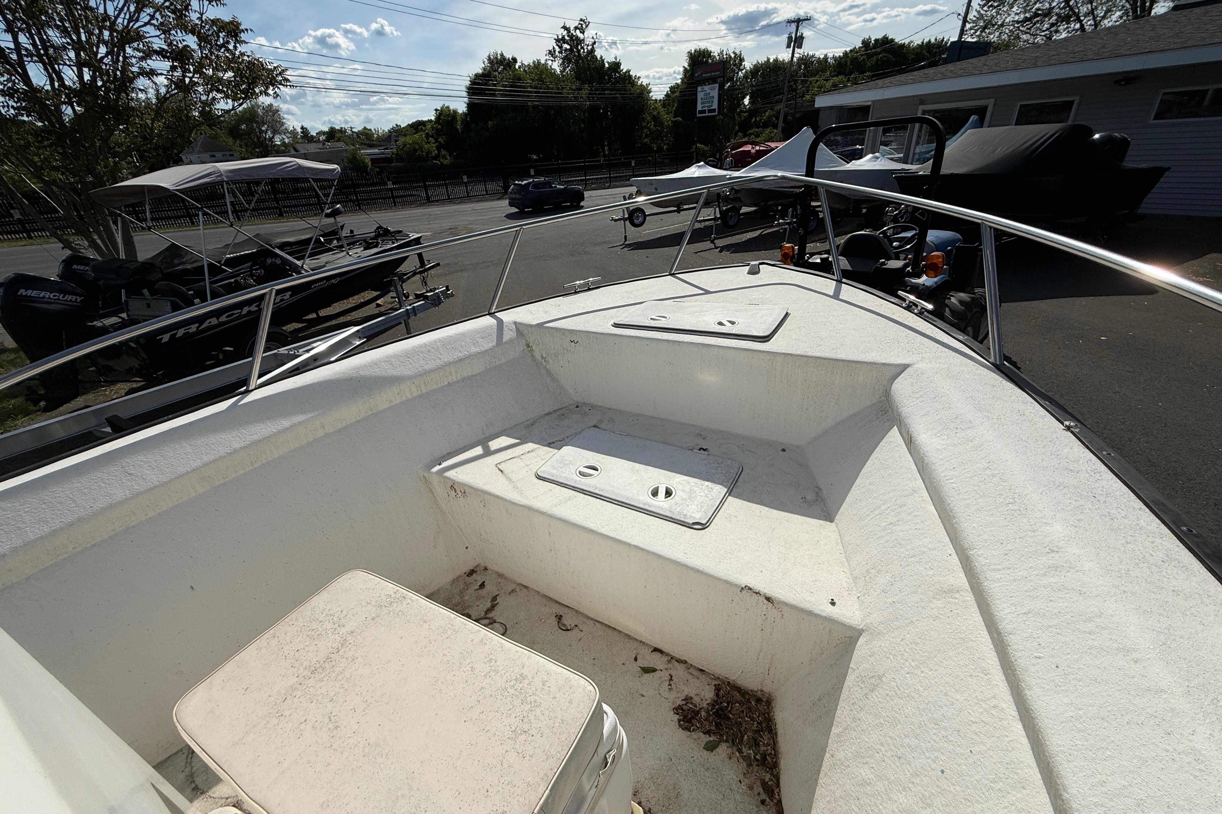 2008 Key Largo 206 Center Console boat, bow view, parked outdoors.